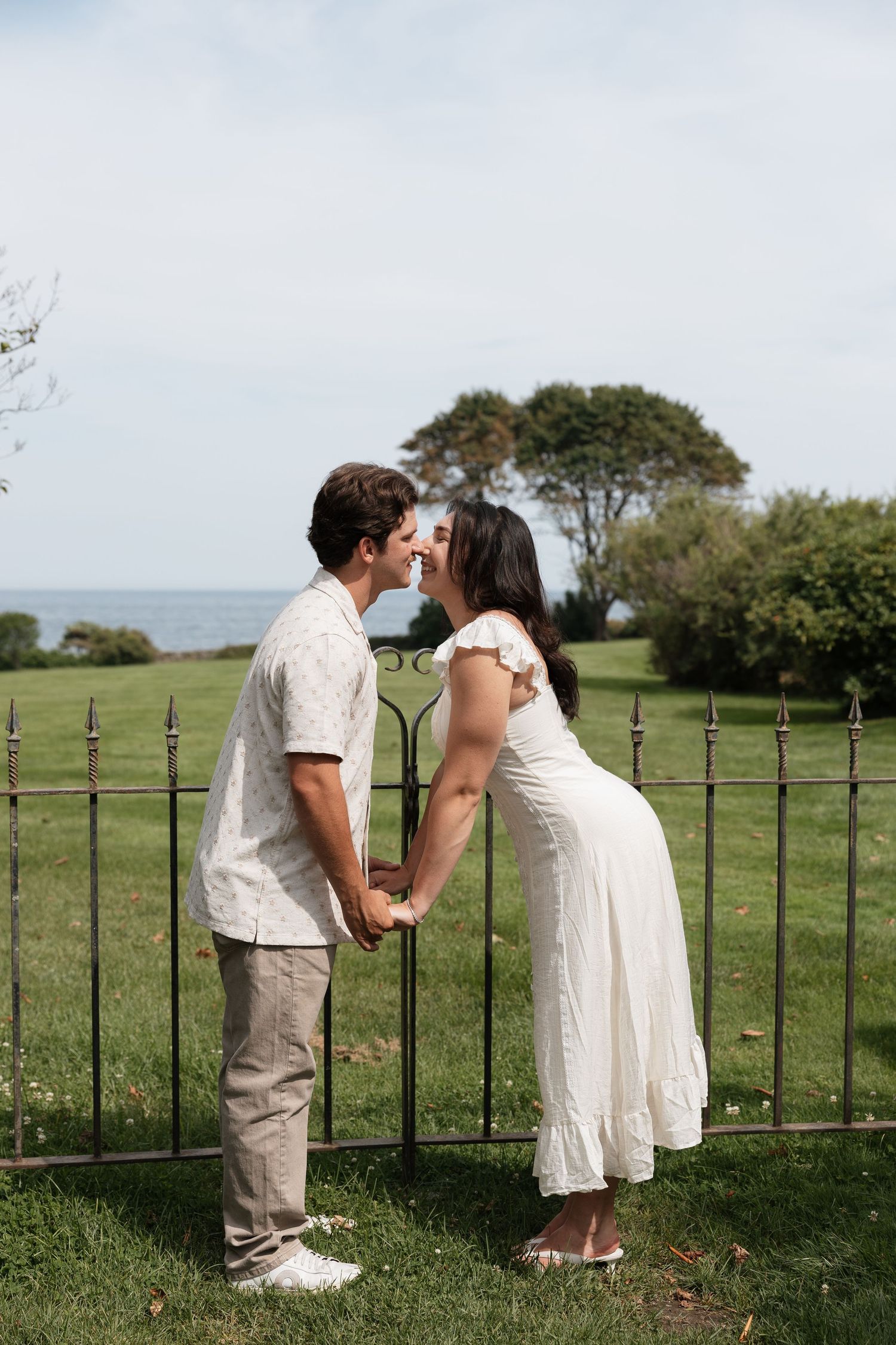 Editorial style couples engagement photoshoot by the water at an estate.