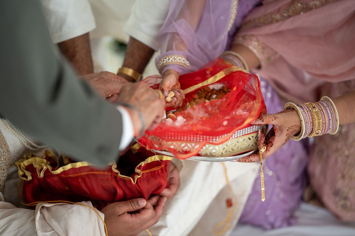 Detailed shots of traditional wedding jewelry and accessories in red and gold.