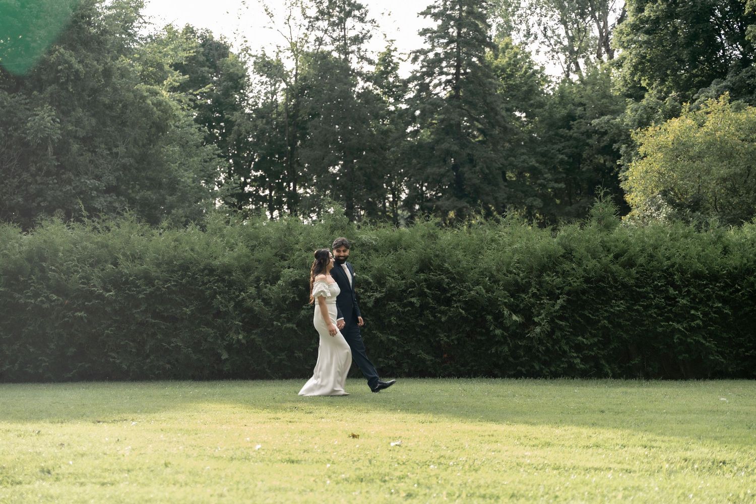 A sequence of wedding photos shows a person in a white dress walking through a lush green garden setting.