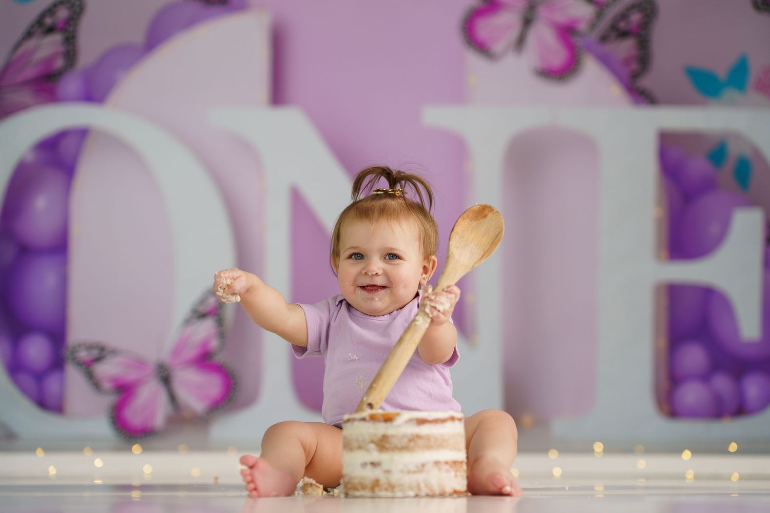 Magical purple themed room with butterfly decorations and warm lighting.
