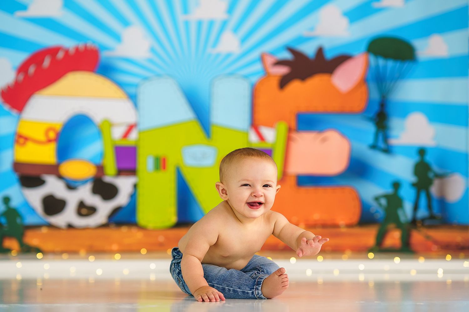 Colorful playroom setting with blue sunburst background and decorative elements.
