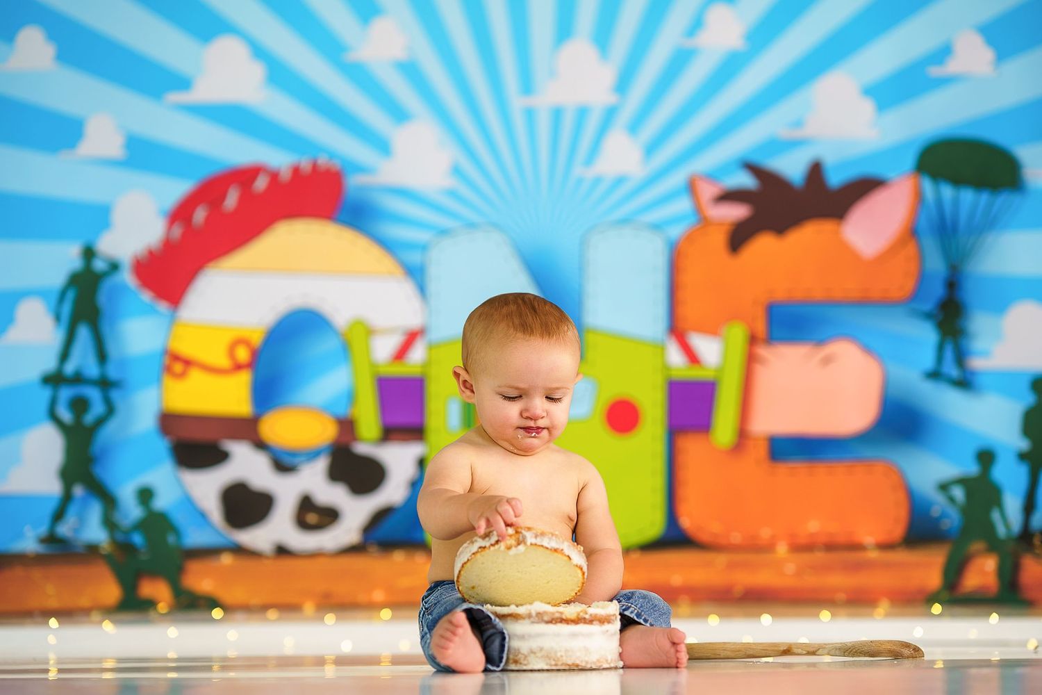 Bright outdoor-themed backdrop with blue sky and sunburst design for photo session.