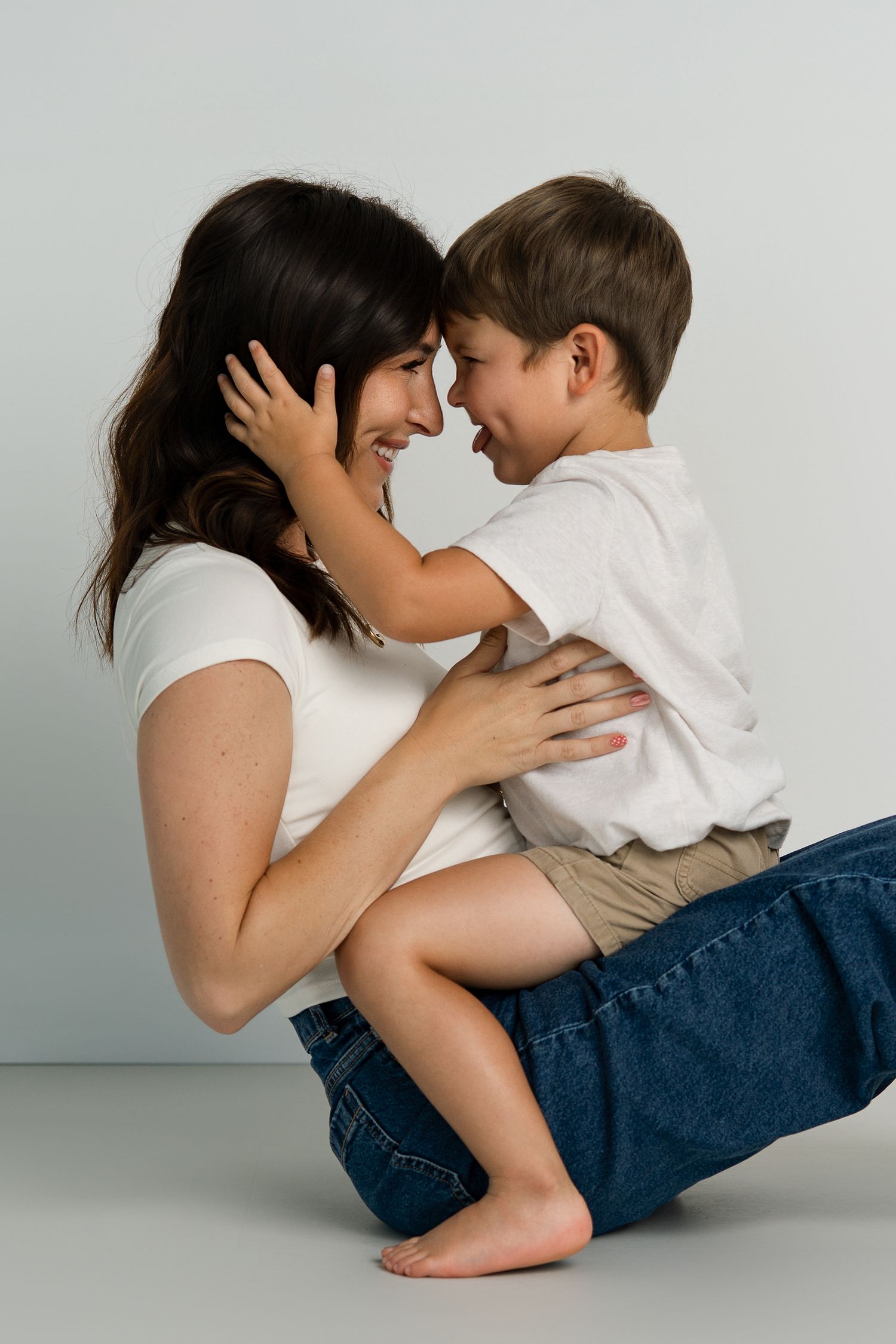Series of loving poses between parent and child on white background showing closeness and connection.