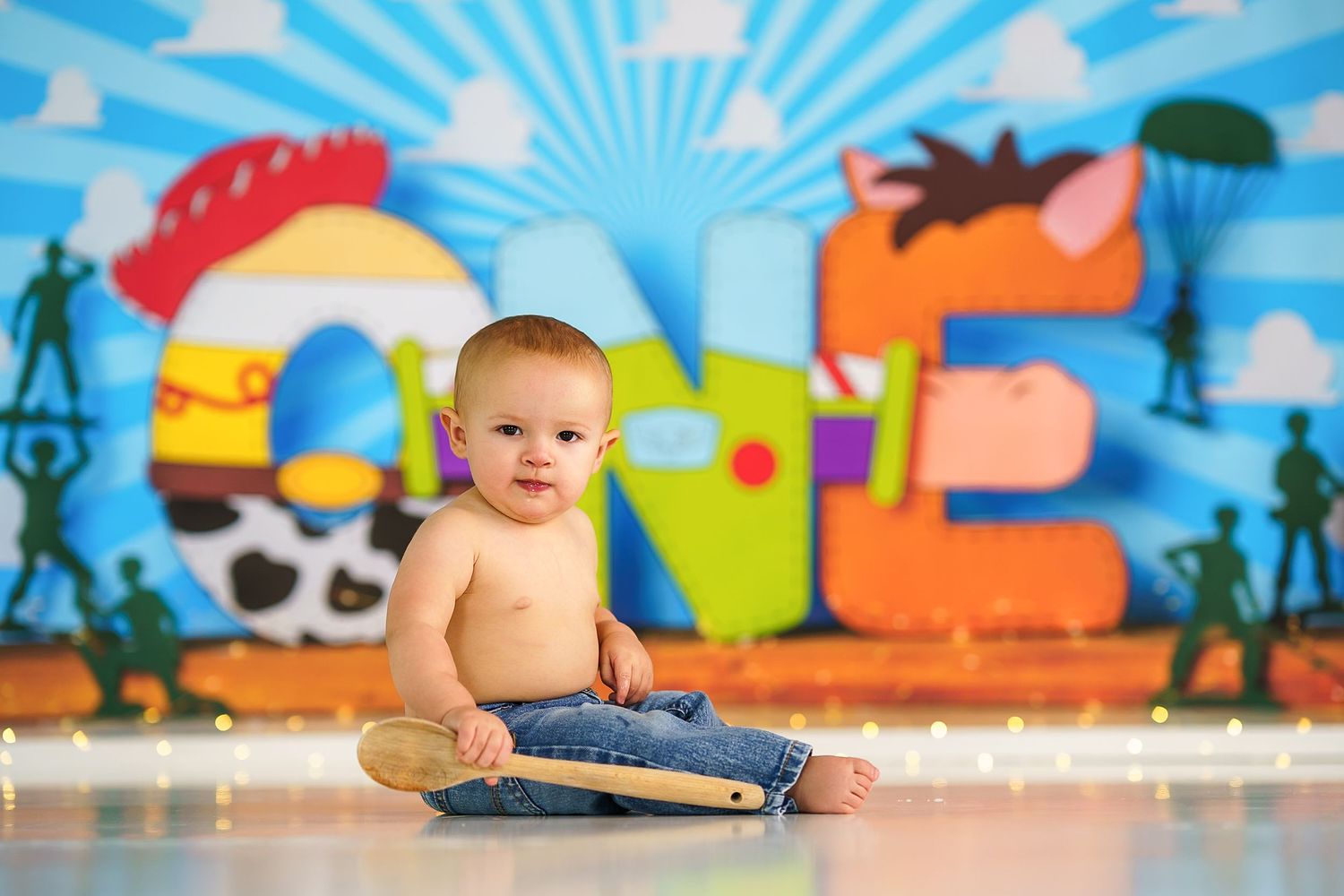 Vibrant cartoon backdrop featuring colorful characters and sunburst design.