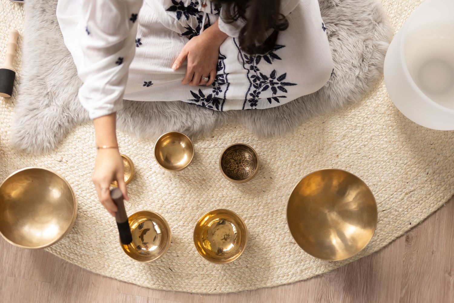 Gold serving bowls arranged on a white textured surface.