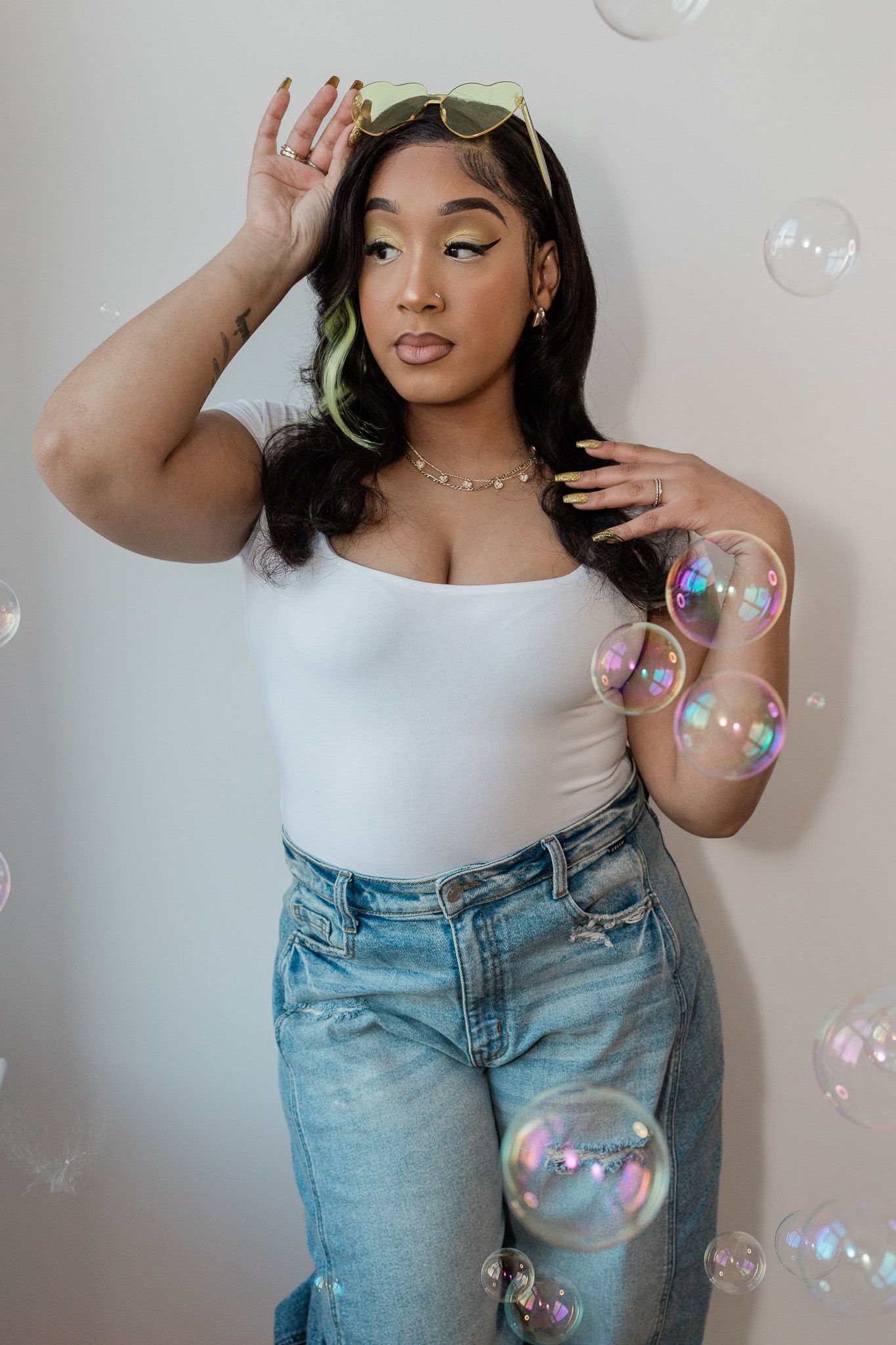 Stylish bubble photography with iridescent soap bubbles against grey background.