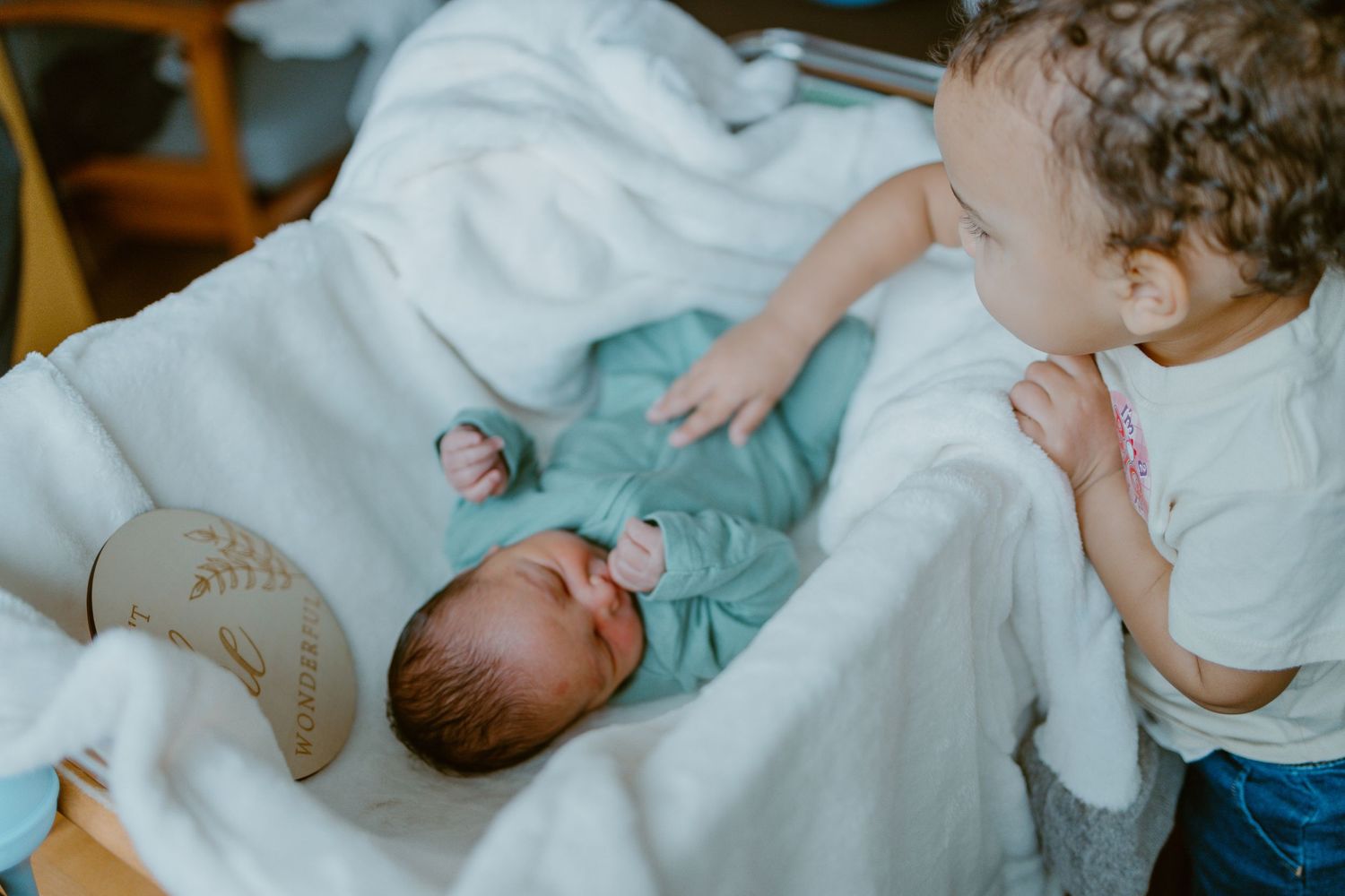 A series of connected images showing medical professionals caring for newborn babies in a hospital setting.