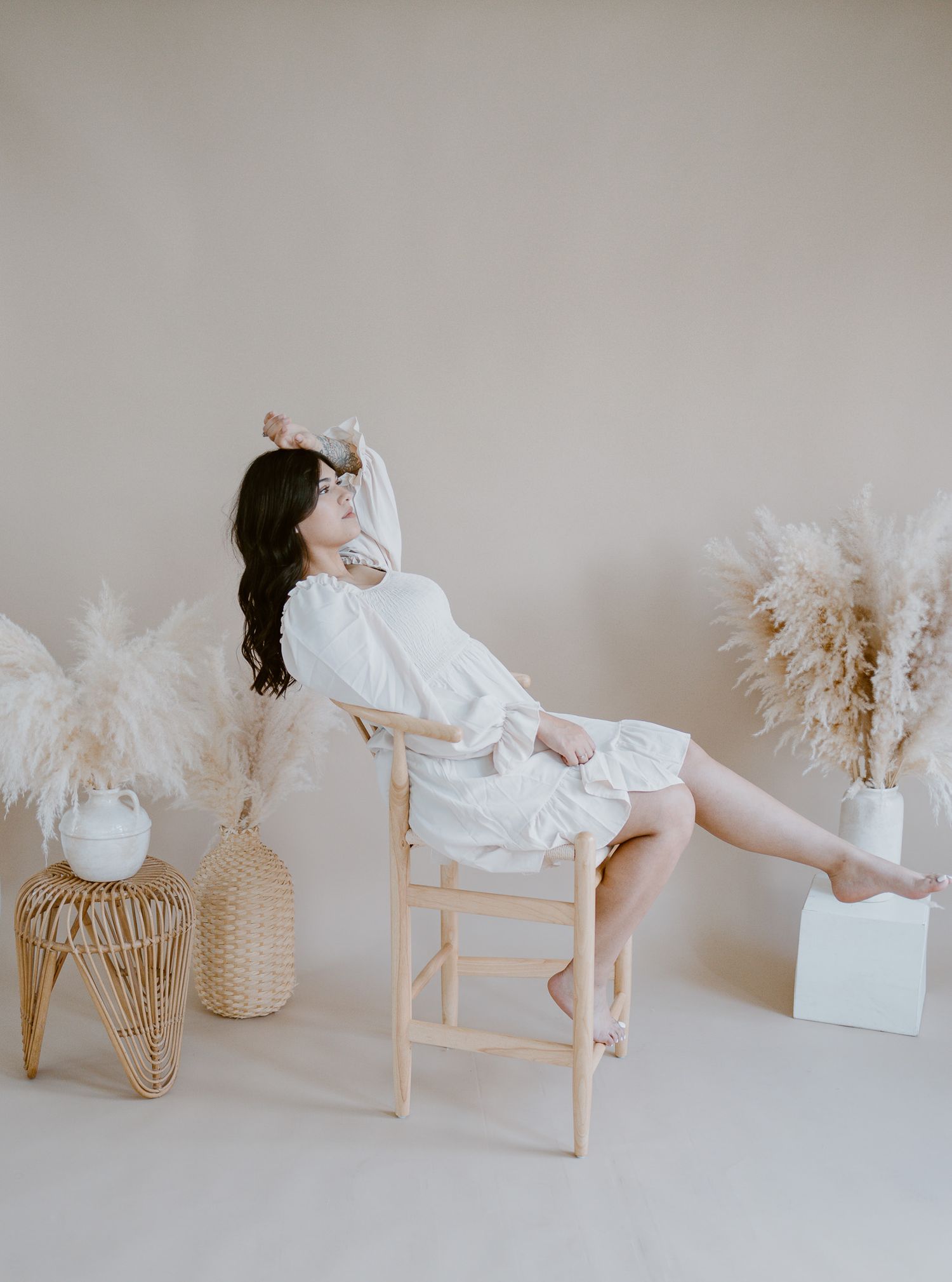 Artistic photo series with white furniture and dried pampas grass arrangements.