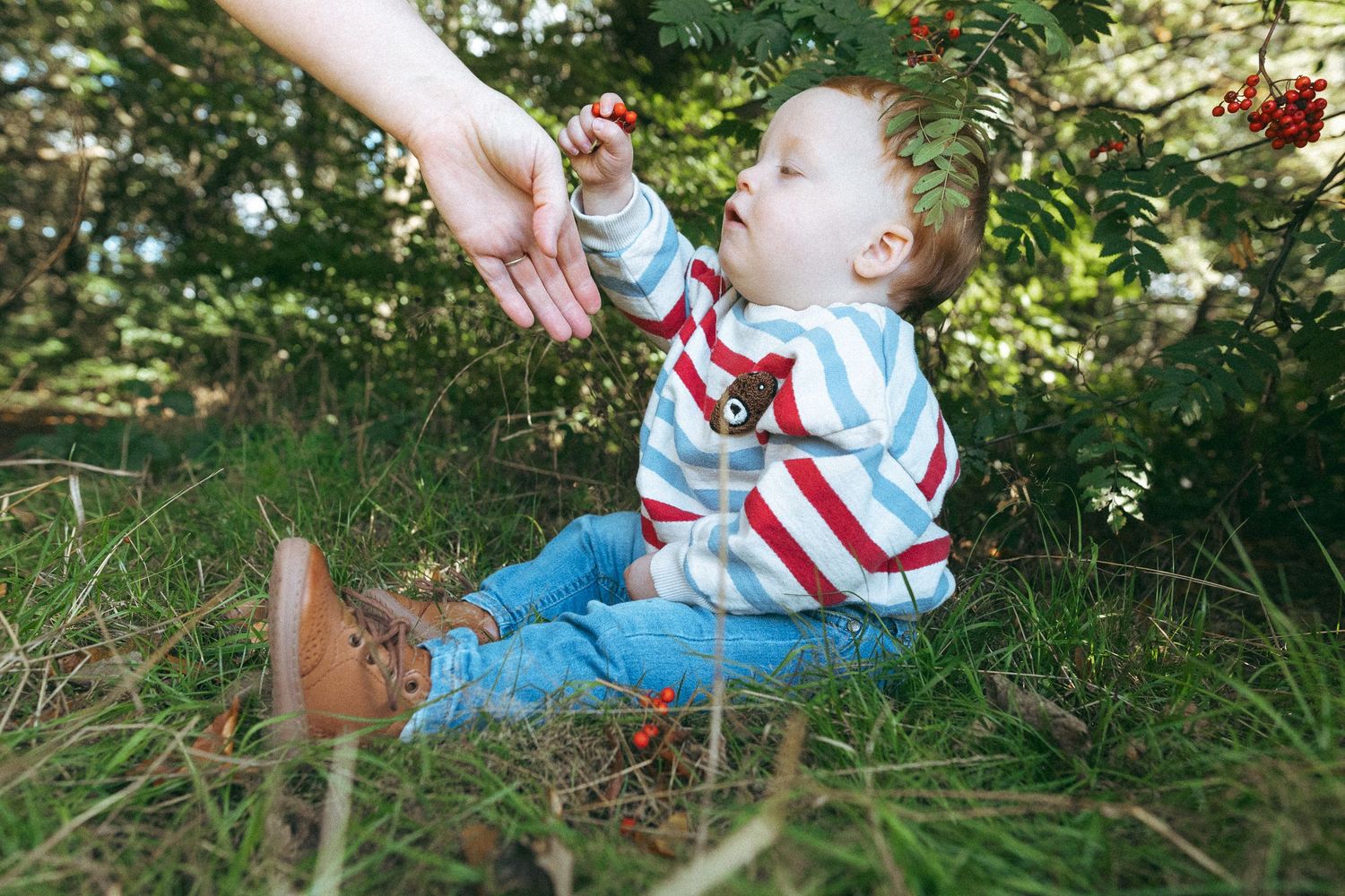 Child showing adult berries