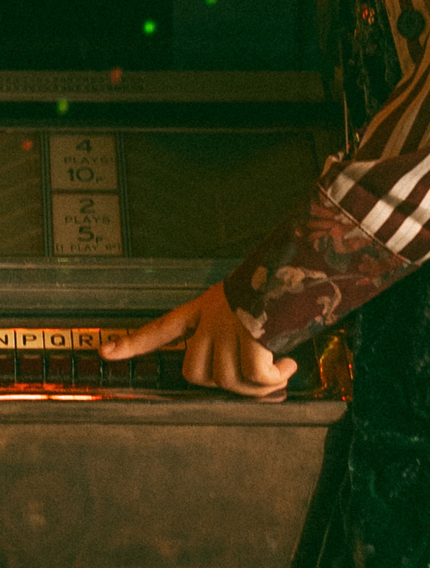 Close up of woman playing with jukebox