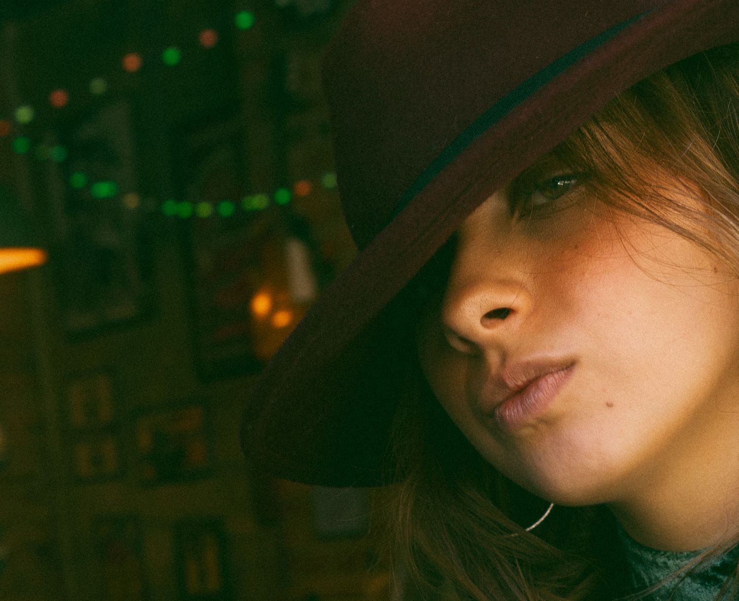 Close up profile of woman outside bar