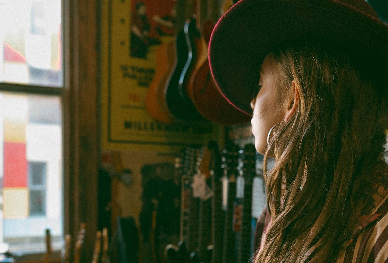 Woman looking at guitars