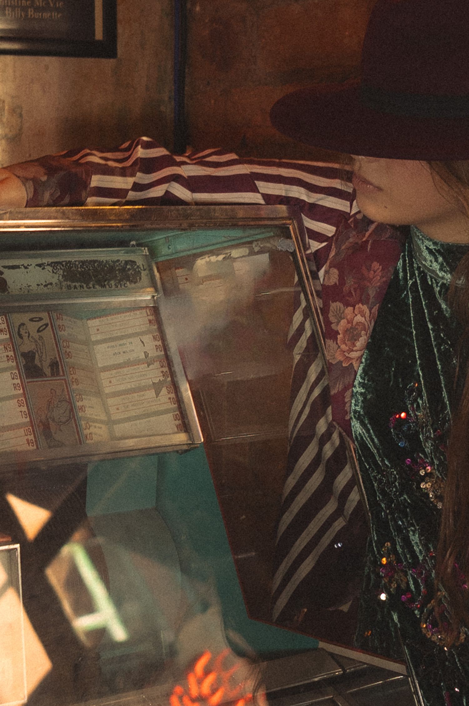 Woman looking at jukebox