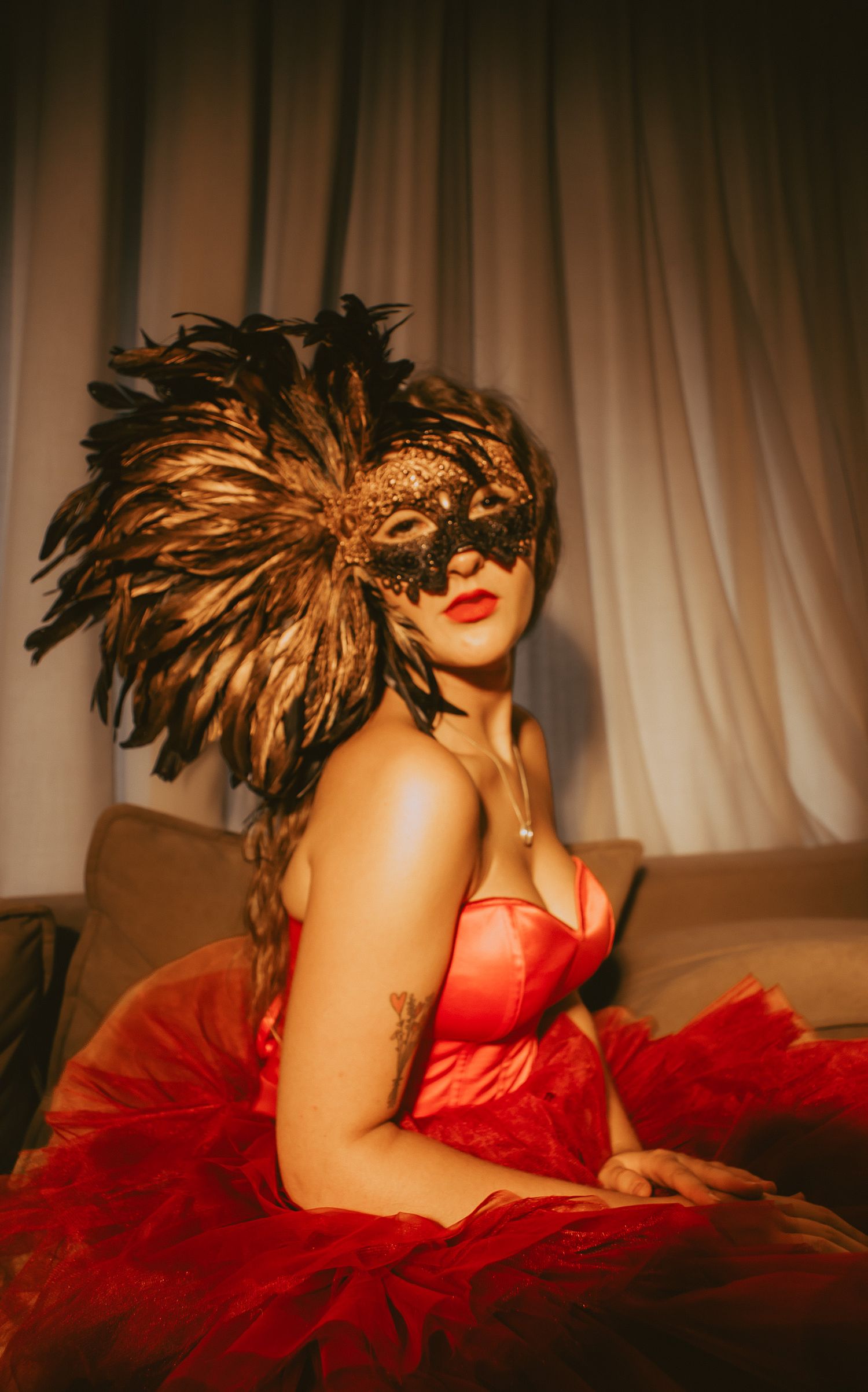 Woman looking seductive in ornate mask
