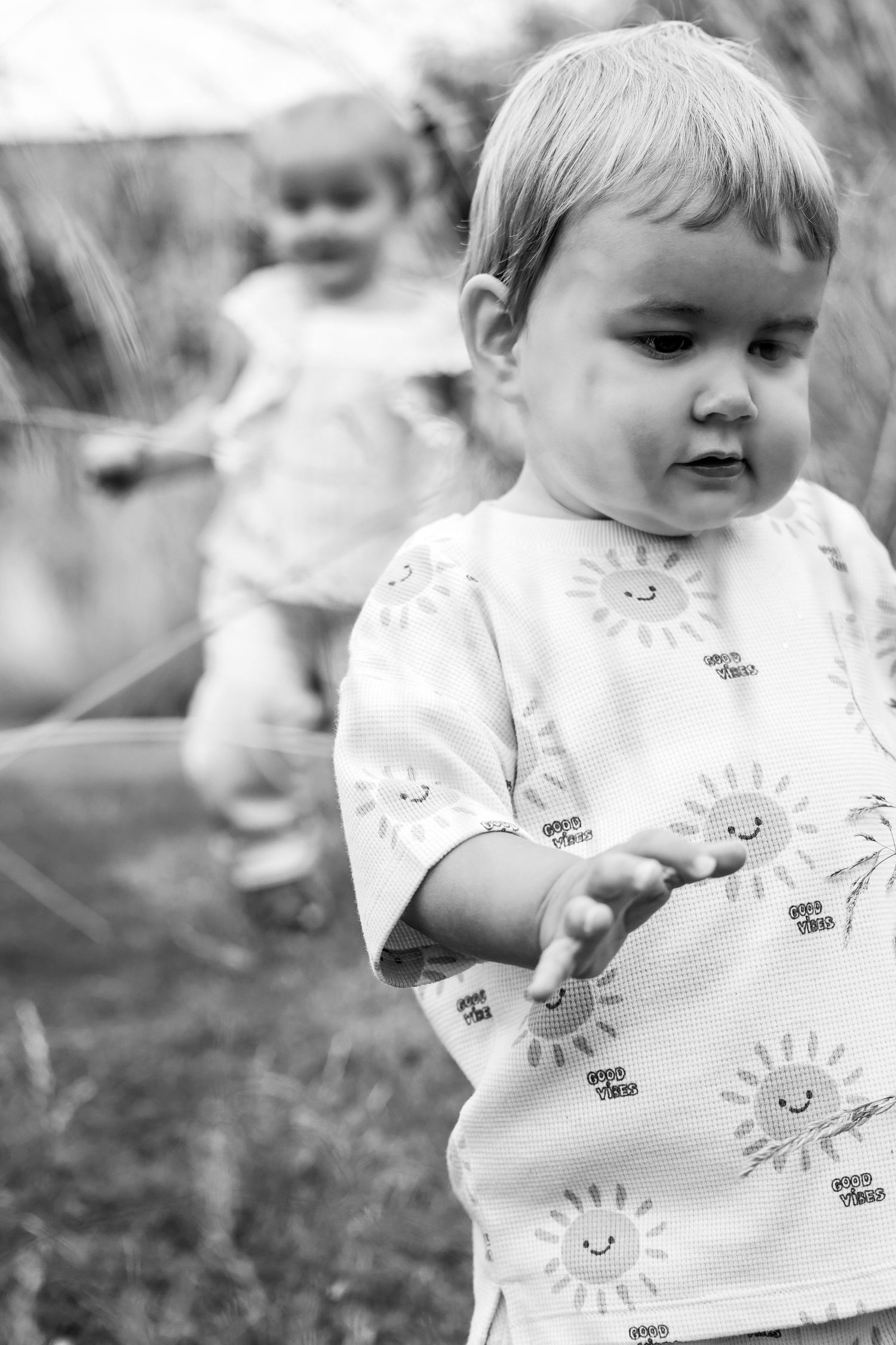 Black and white portrait of children running