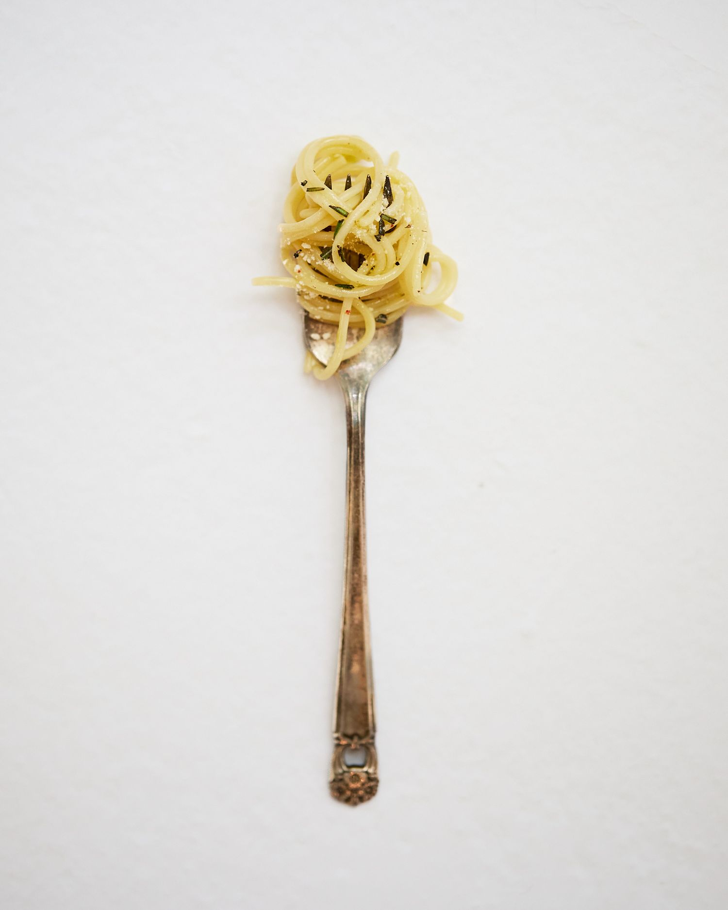 Vintage fork wrapped with spaghetti with TruTruffle oil.