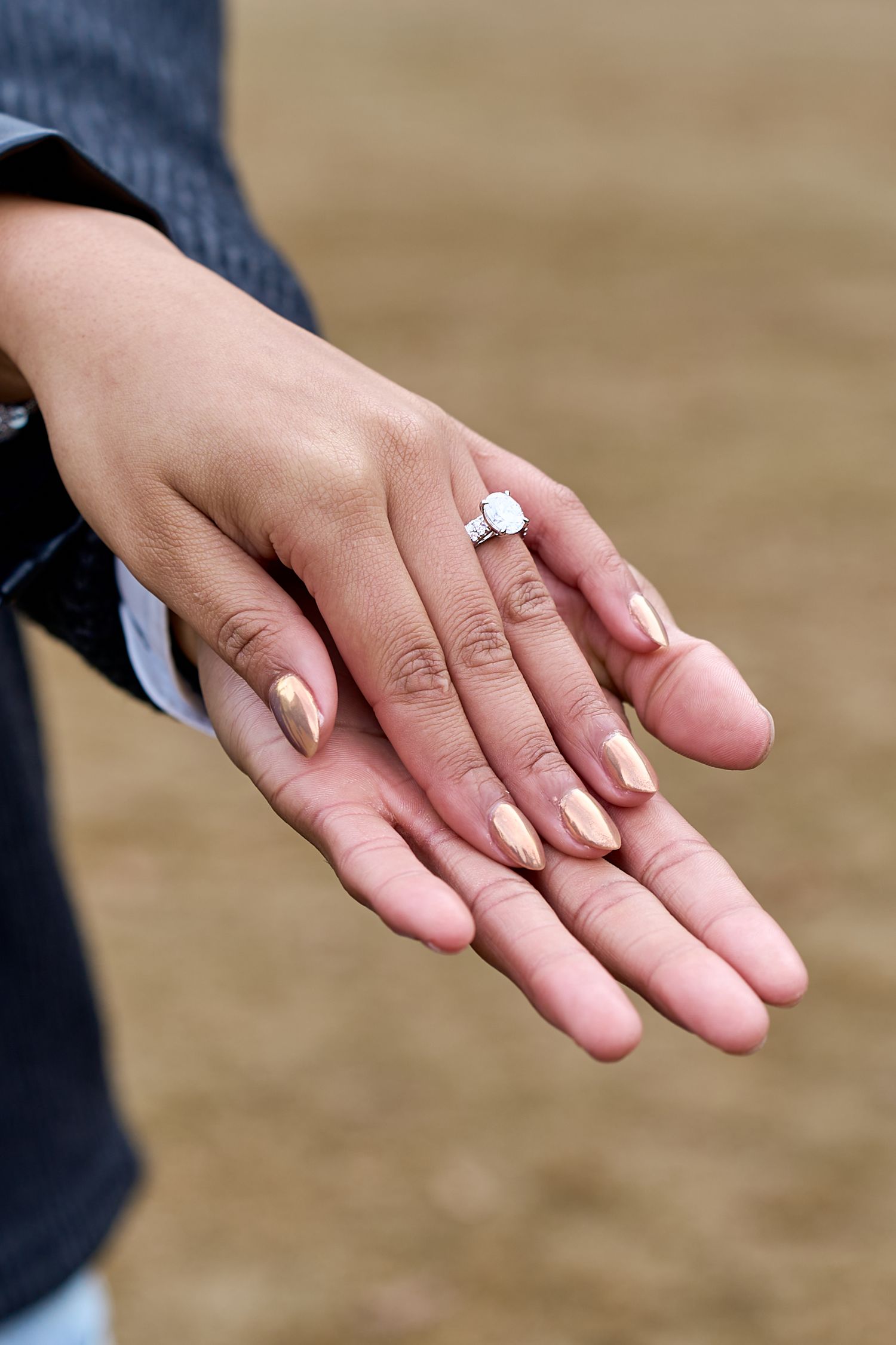 A series of close-up photos showing a hand with a diamond engagement ring from different angles. North Carolina Wedding Photographer.