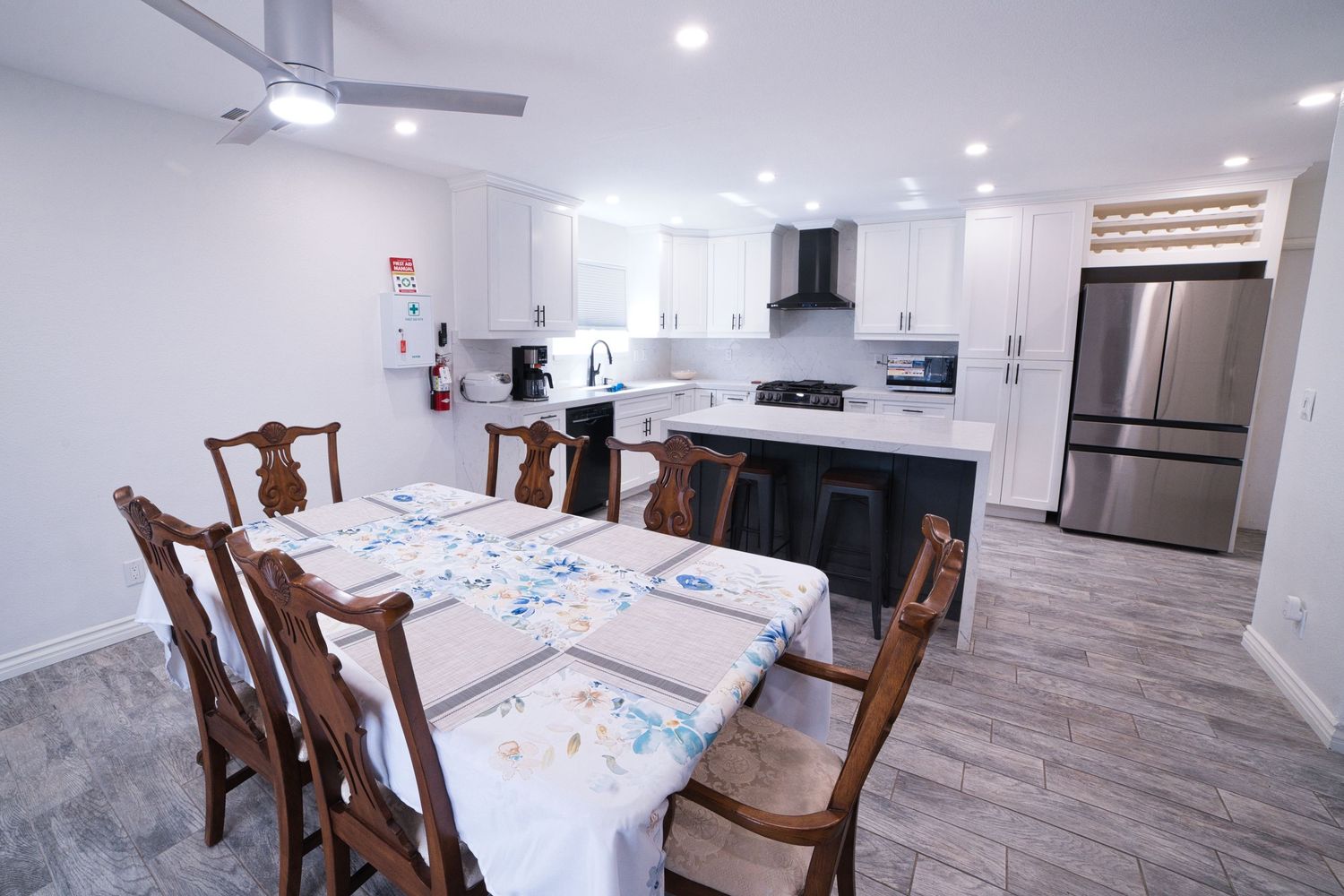 communal kitchen and dining area at 1st Care Facility, home based RCFE, residential care facility for elderly in Highland, CA