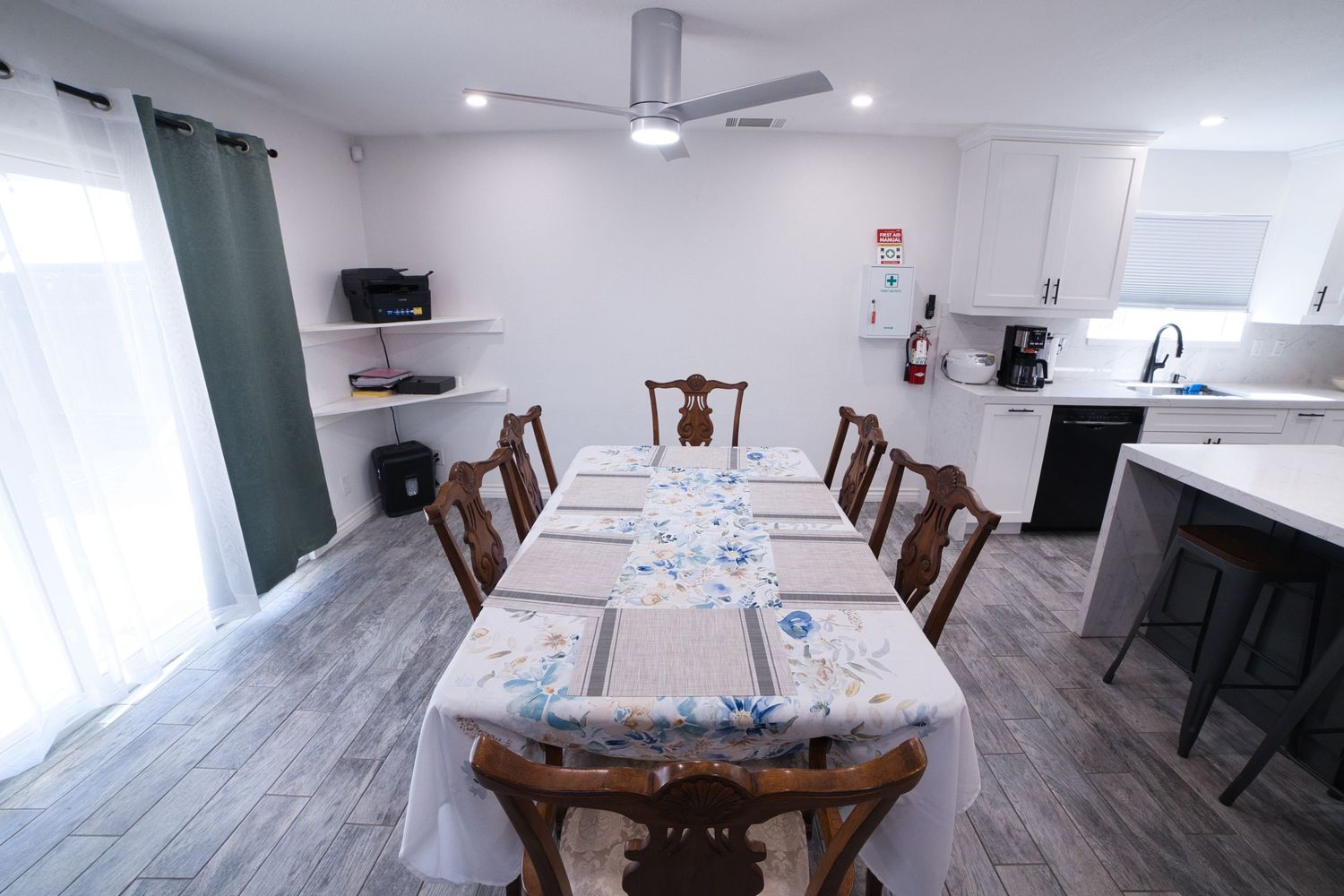 communal kitchen and dining area at 1st Care Facility, home based RCFE, residential care facility for elderly in Highland, CA