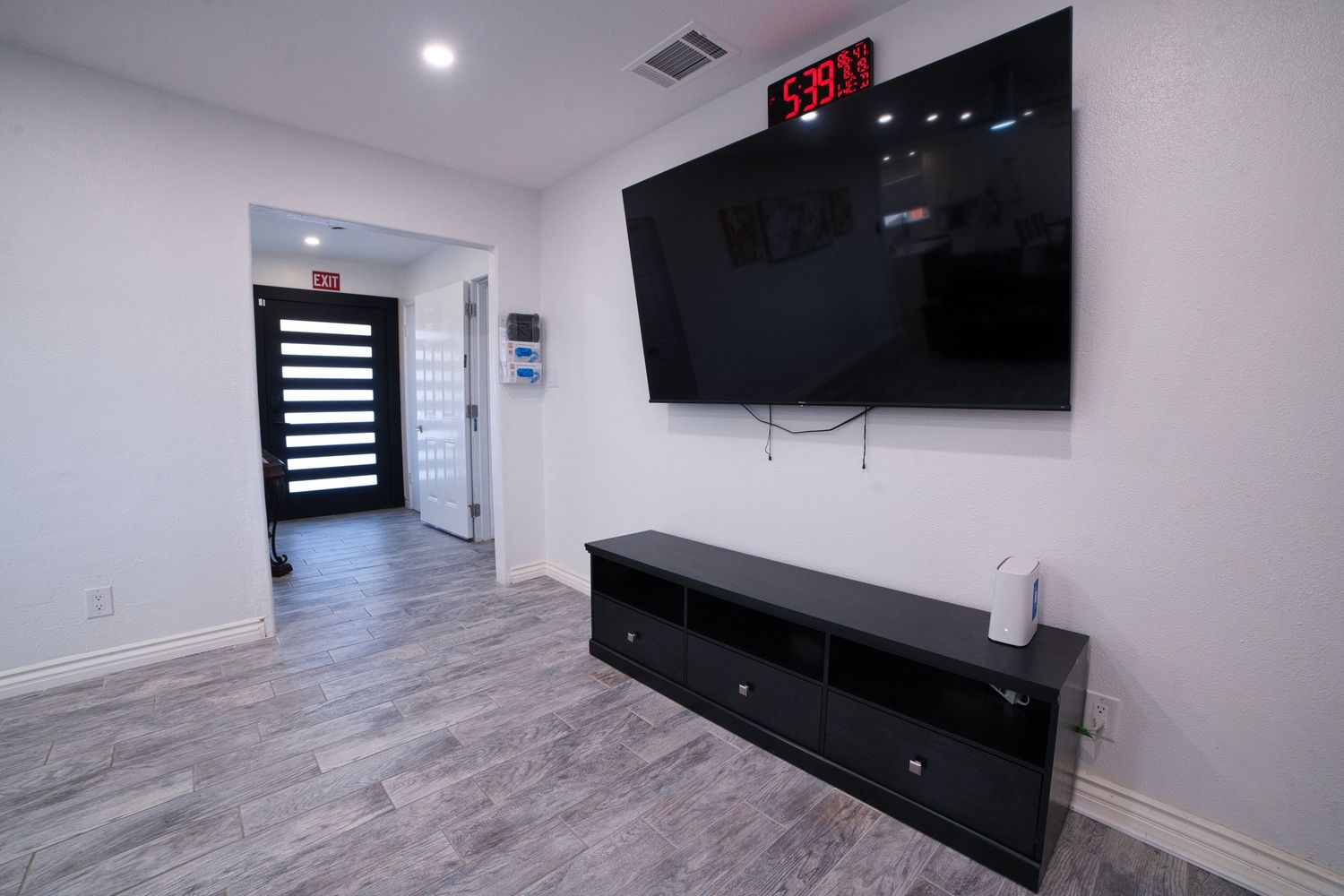 communal living room with TV and sectonal sofa at 1st Care Facility, home based RCFE, residential care facility for elderly in Highland, CA