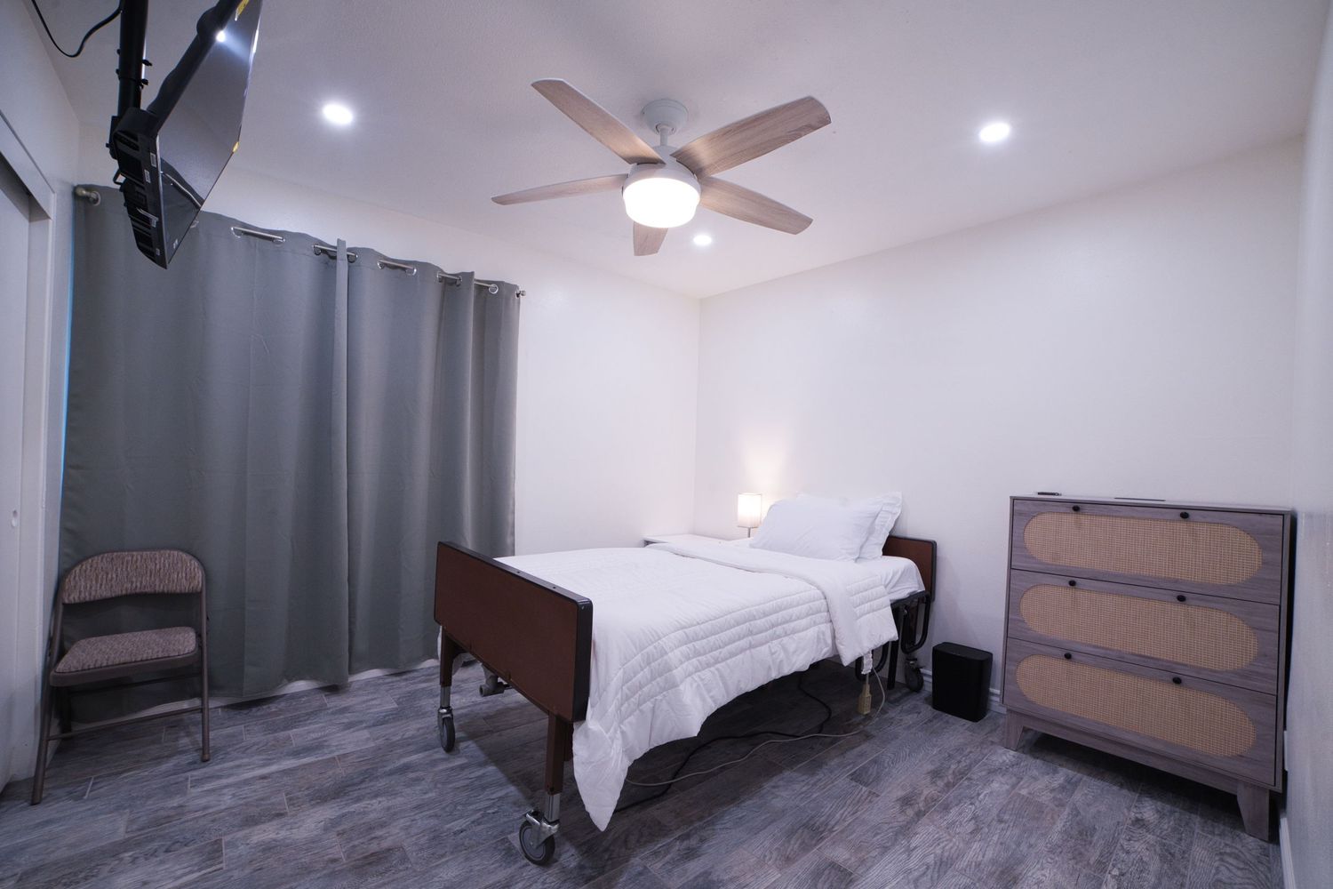 view of private bedroom 4 with personal TV at 1st Care Facility, home based RCFE, residential care facility for elderly in Highland, CA