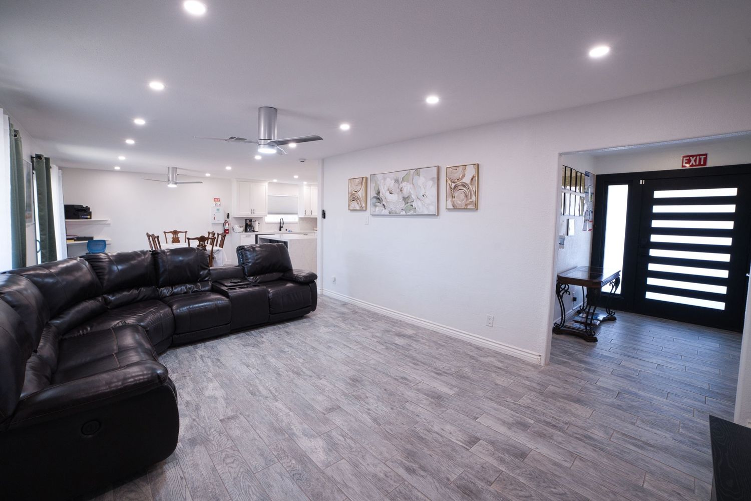 communal living room with TV and sectonal sofa at 1st Care Facility, home based RCFE, residential care facility for elderly in Highland, CA