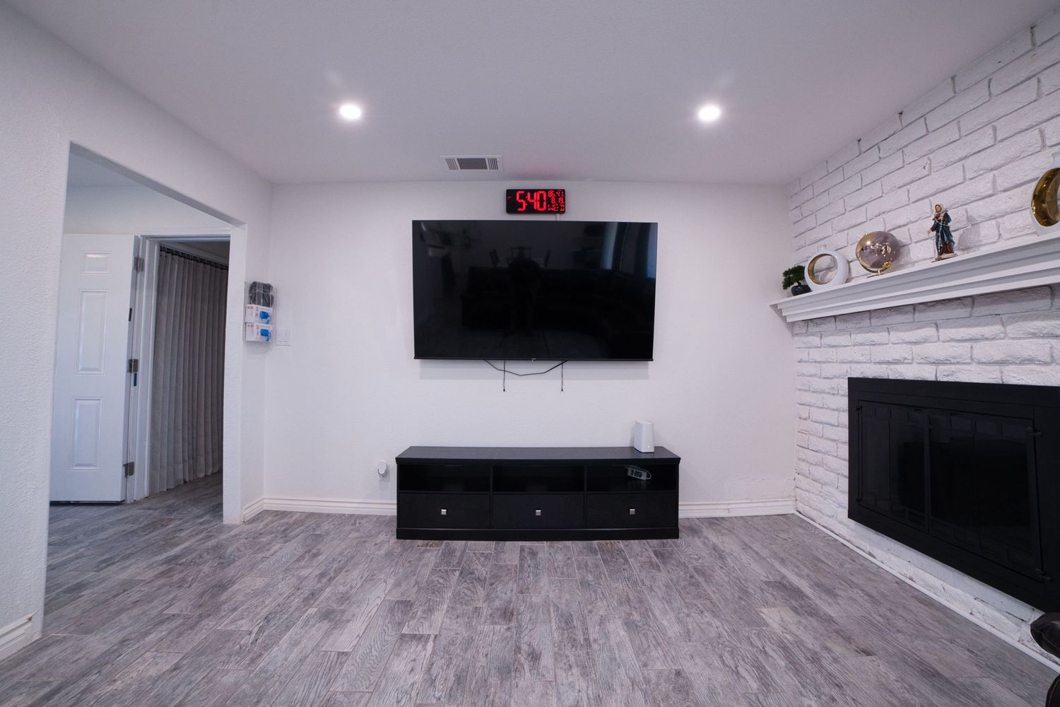communal living room with TV and sectonal sofa at 1st Care Facility, home based RCFE, residential care facility for elderly in Highland, CA
