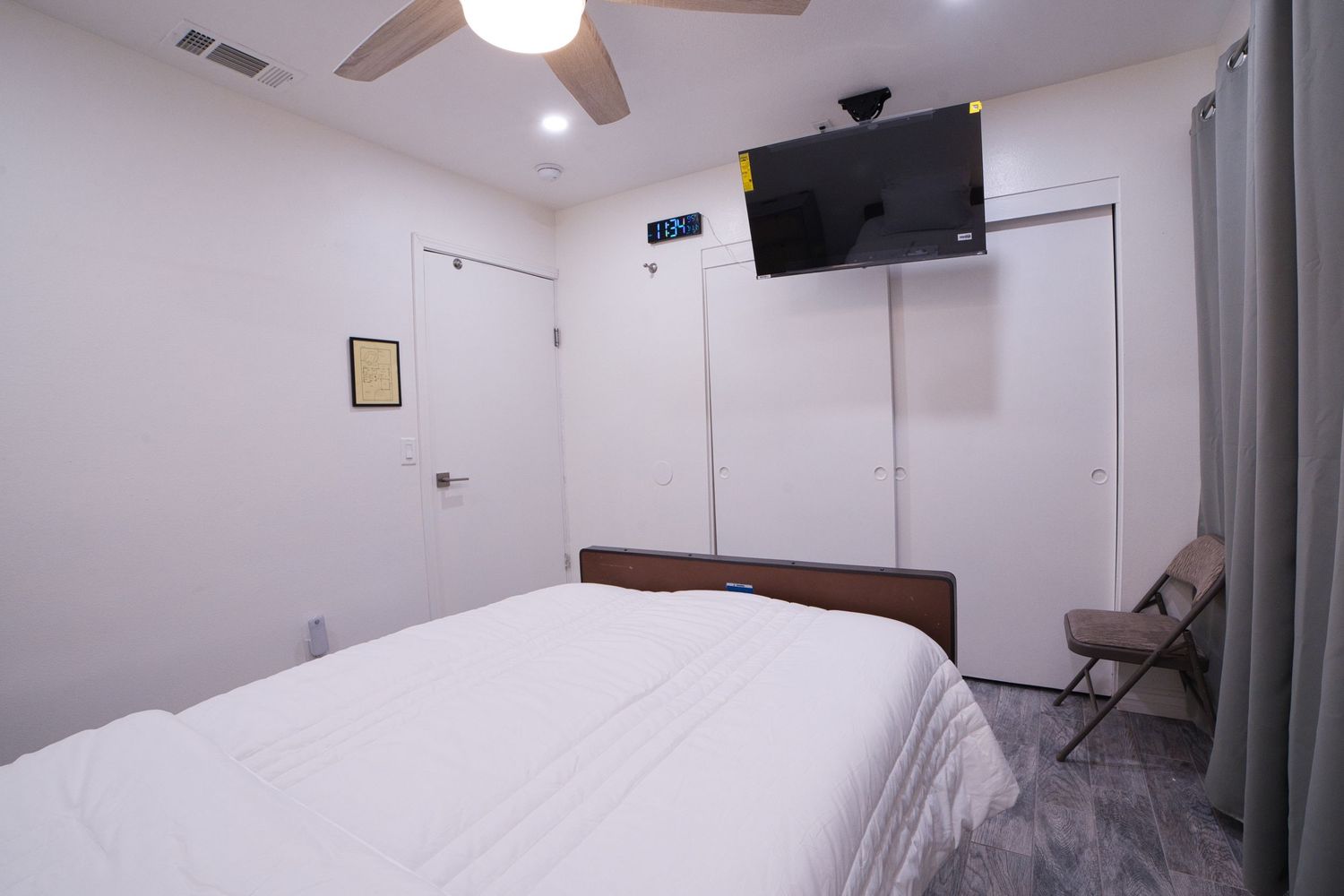 view of private bedroom 4 with personal TV at 1st Care Facility, home based RCFE, residential care facility for elderly in Highland, CA