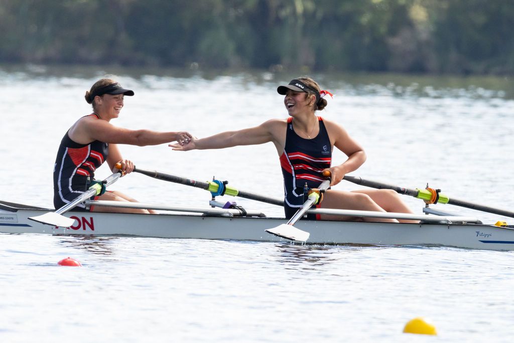 Claire House Photography sports event photograph of two female rowers celebrating after a race.