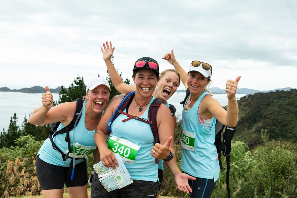 Claire House Photography event photograph of four women adventure athletes celebrating at Wander Women Adventure Race.