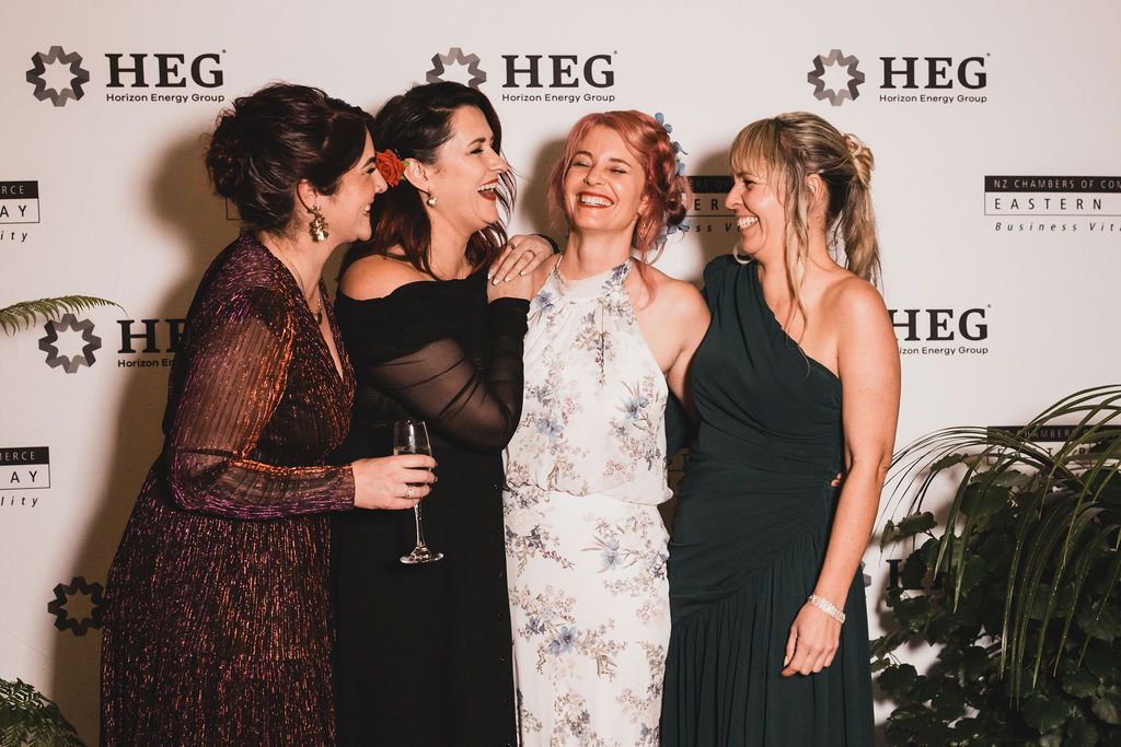 Claire House Photography event photograph of four women laughing together at HEG Business Awards.