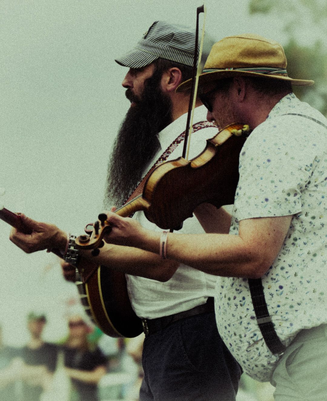 Rustic image of 2 men playing musical instruments