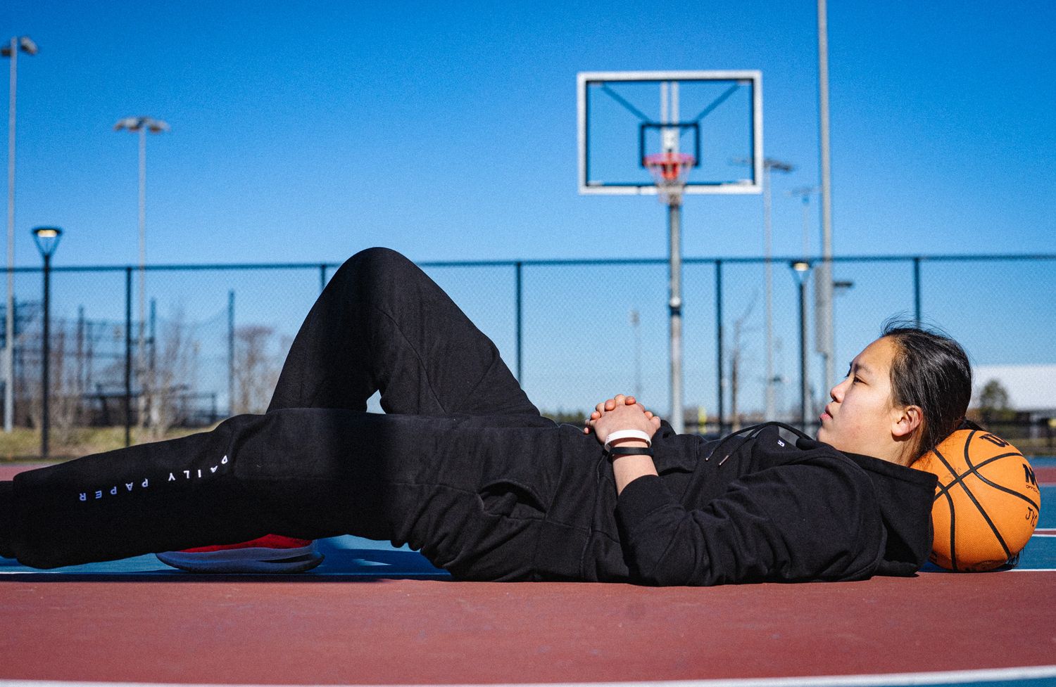 dramatic high-contrast media day for women's basketball recruit.