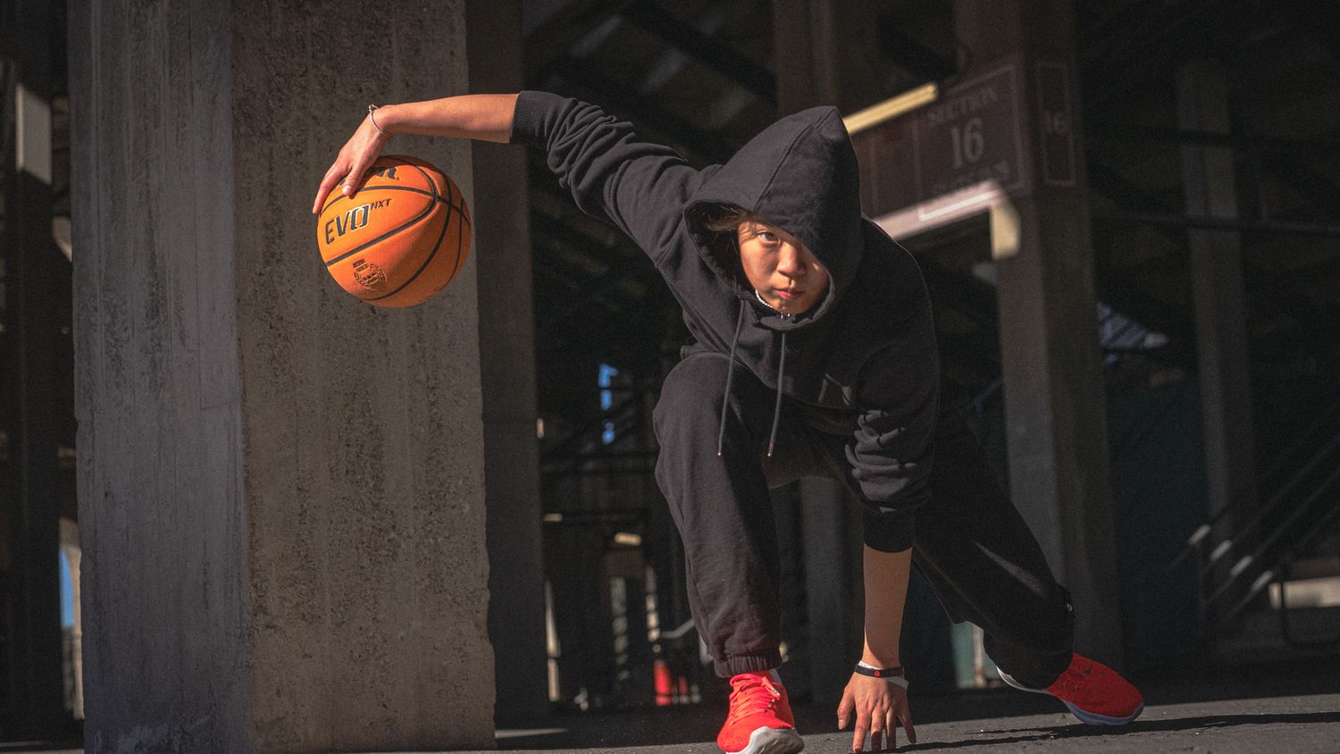 dramatic high-contrast media day for women's basketball recruit.