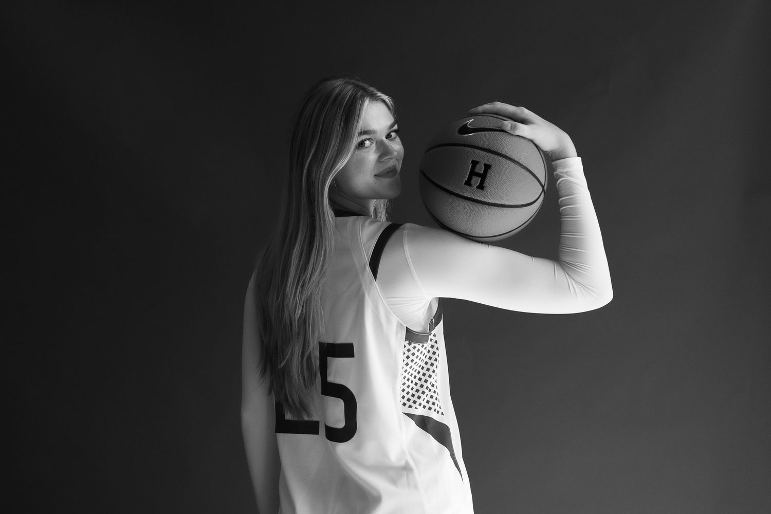 dramatic high-contrast media day for women's basketball recruit.