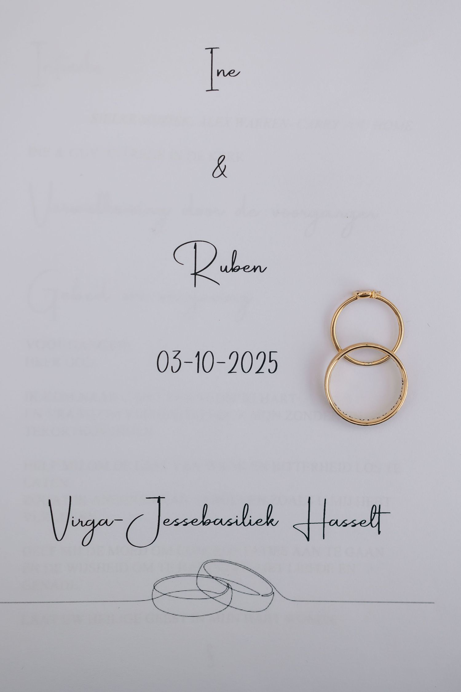 Wedding invitation for Ine and Ruben on 03-10-2025 at Virga-Jessebasiliek Hasselt with gold rings.
