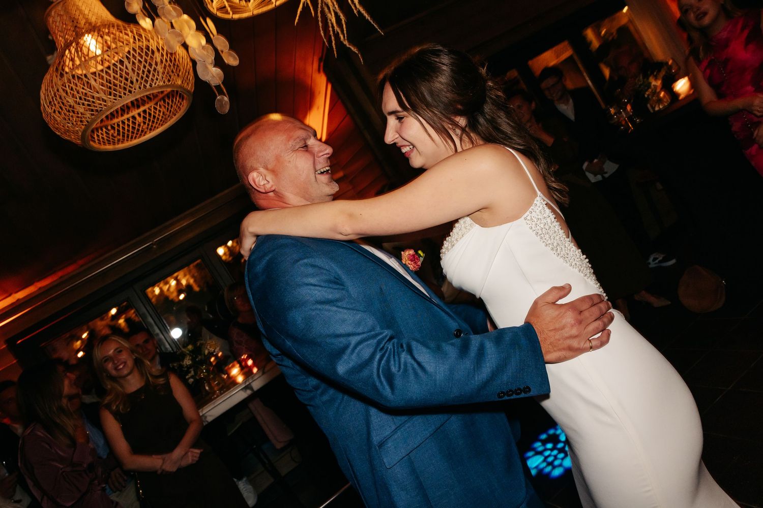 Bride and groom share a romantic first dance at their wedding reception.