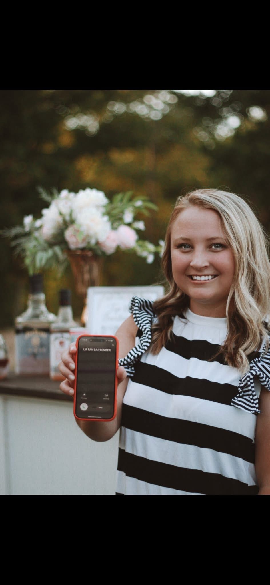 Emily Crow of the Anna Mae & Co. mobile bar team at an outdoor event.