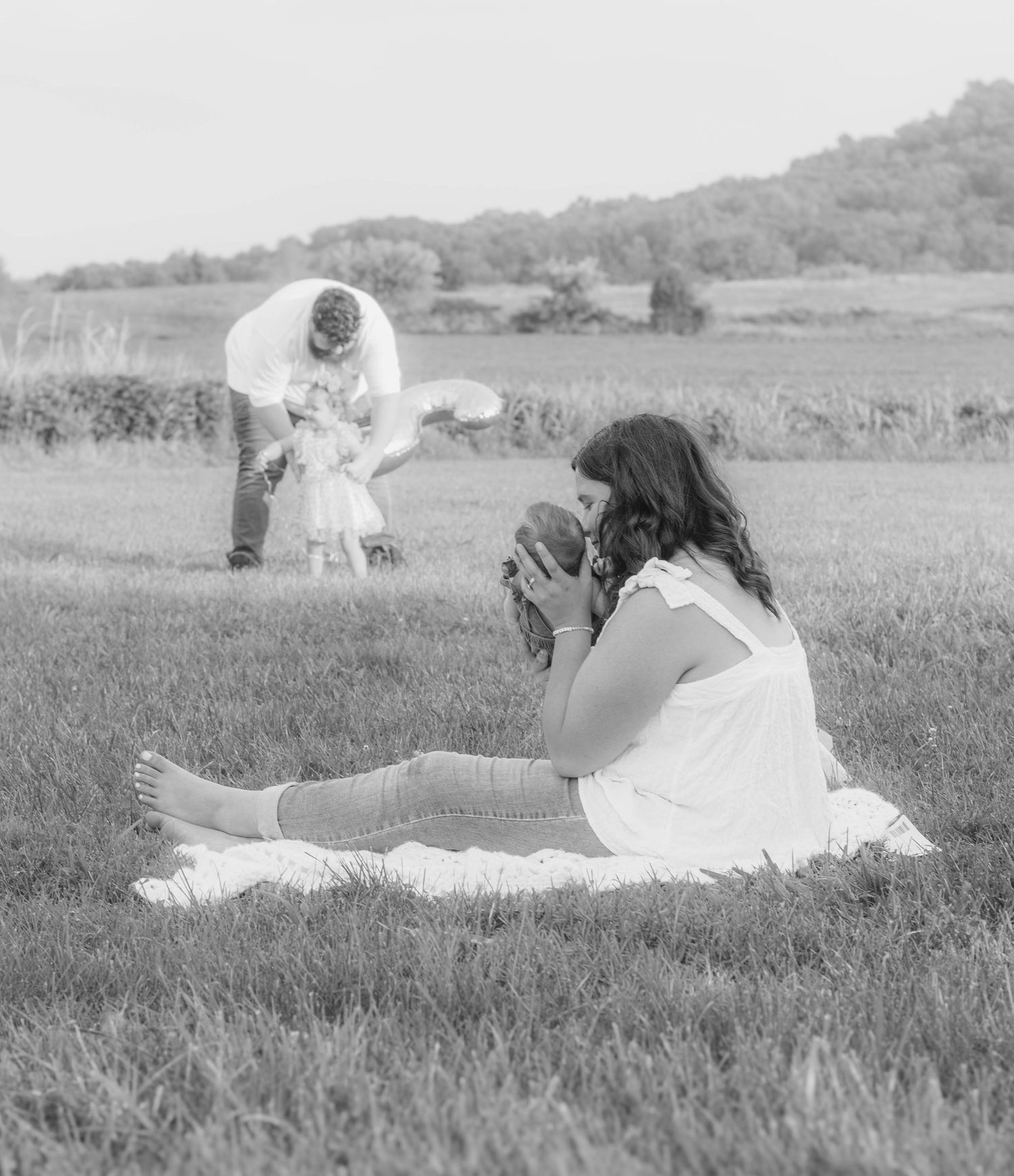 Mother holding her child outdoors during a family session