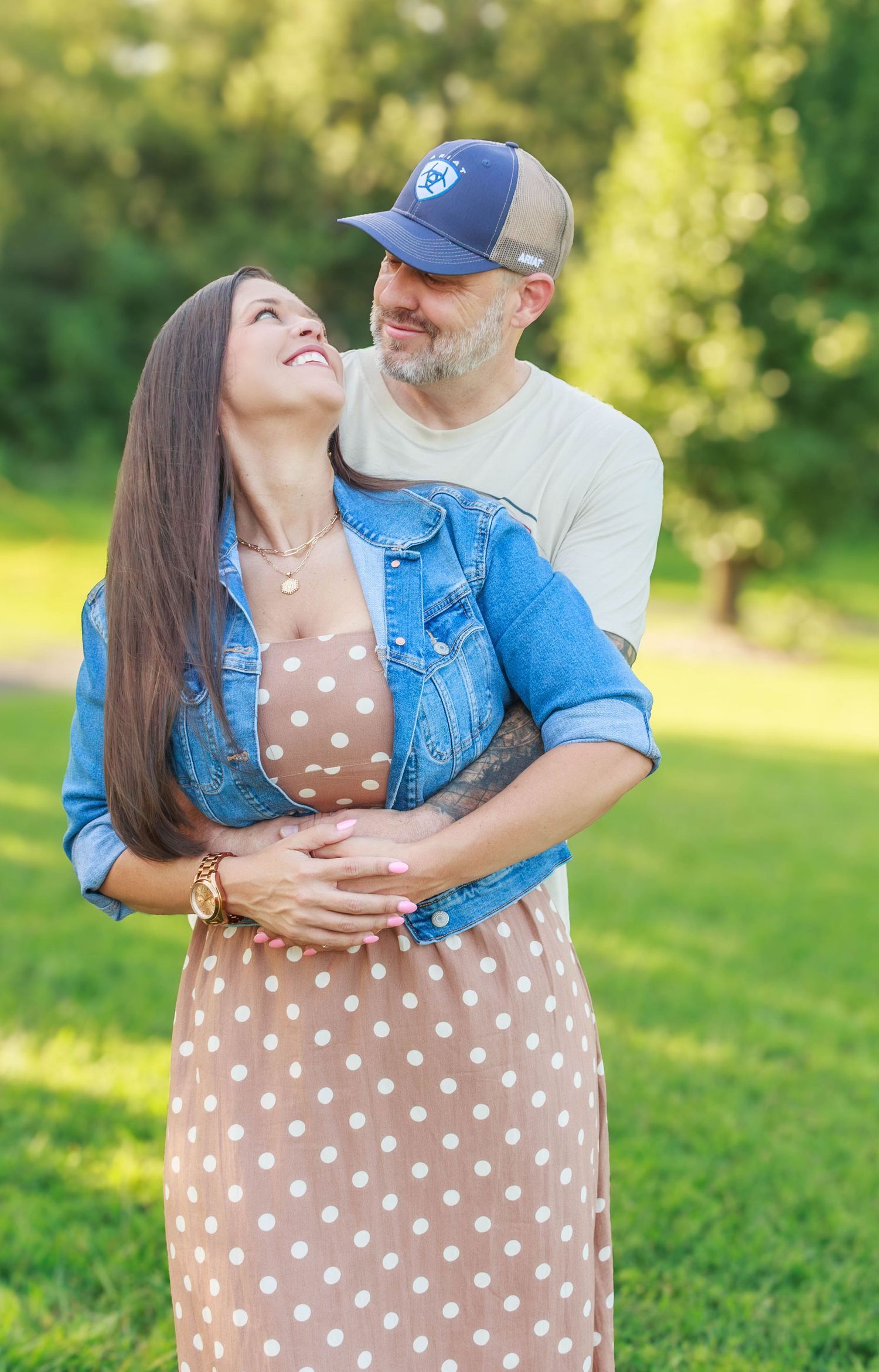 Couple embracing outdoors during a relaxed family photography session