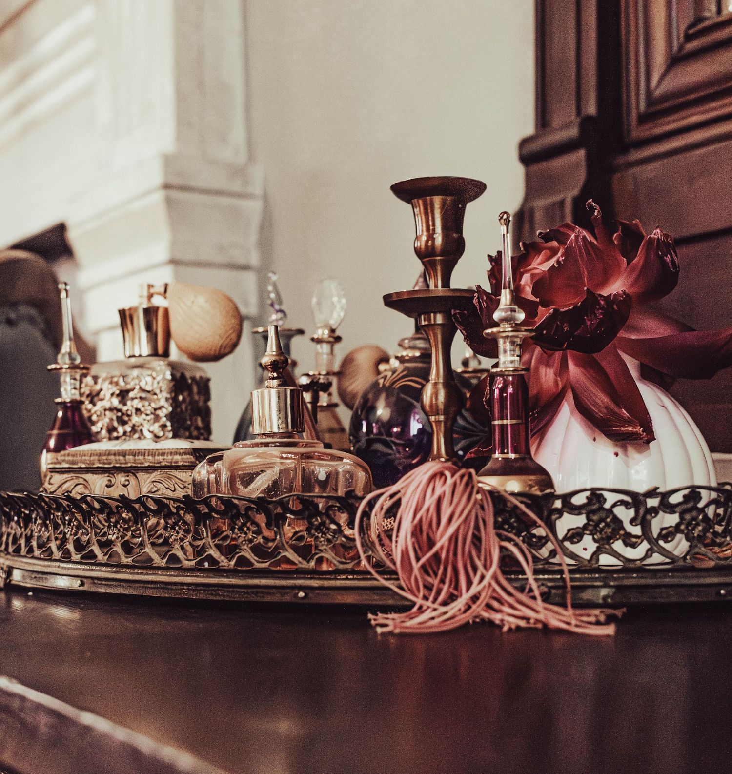 Elegant wedding details arranged on a vintage dresser.