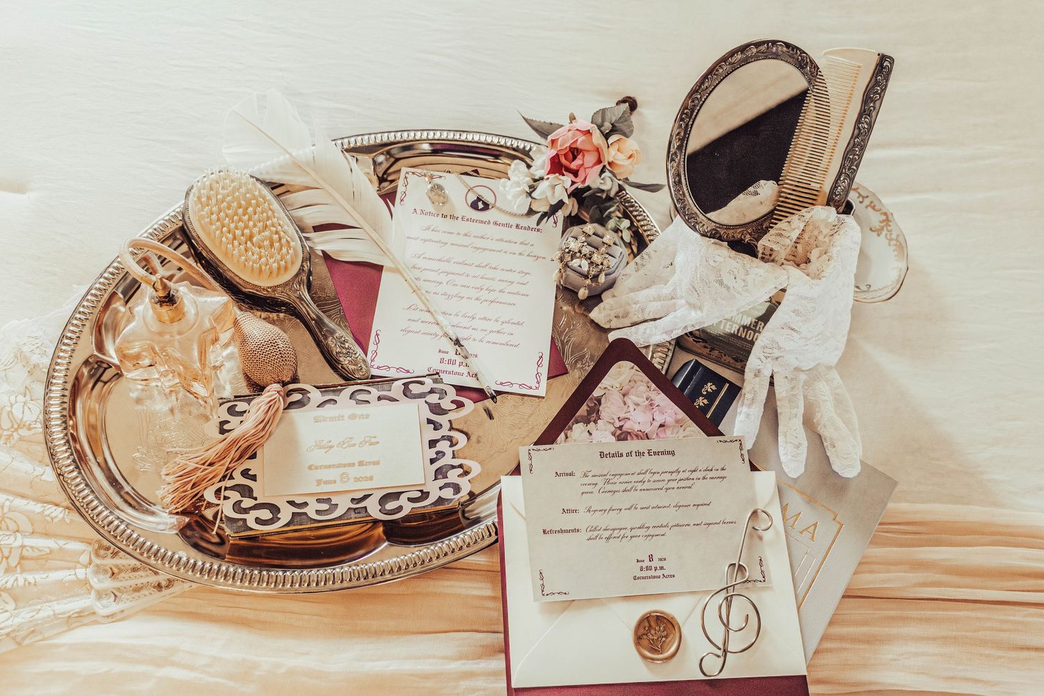 Vintage-inspired wedding detail display with bridal accessories, stationery, mirror and keepsakes.