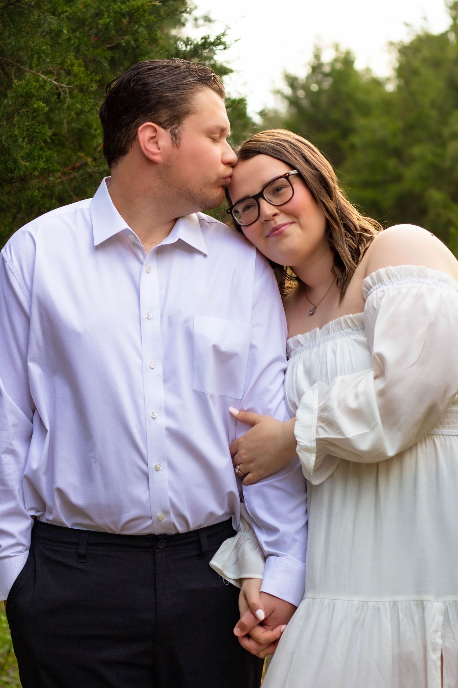 Couple embracing during a romantic outdoor portrait session.