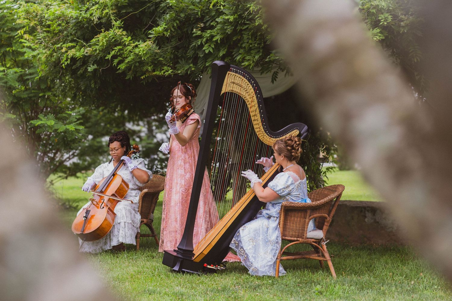 Musicians performing outdoors during a wedding celebration.