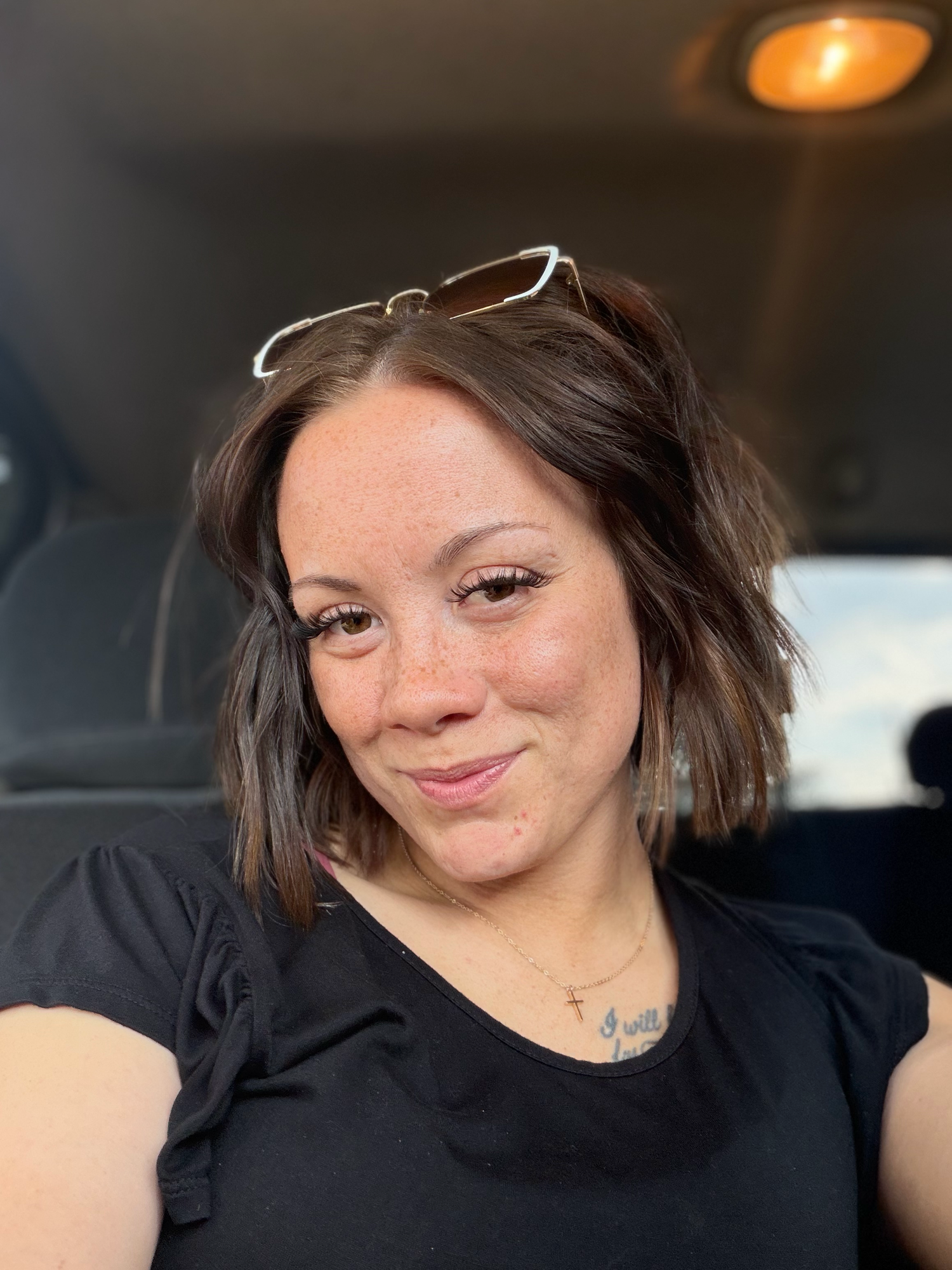 Kali Jo, manager of Anna Mae & Co., smiling for a casual portrait.