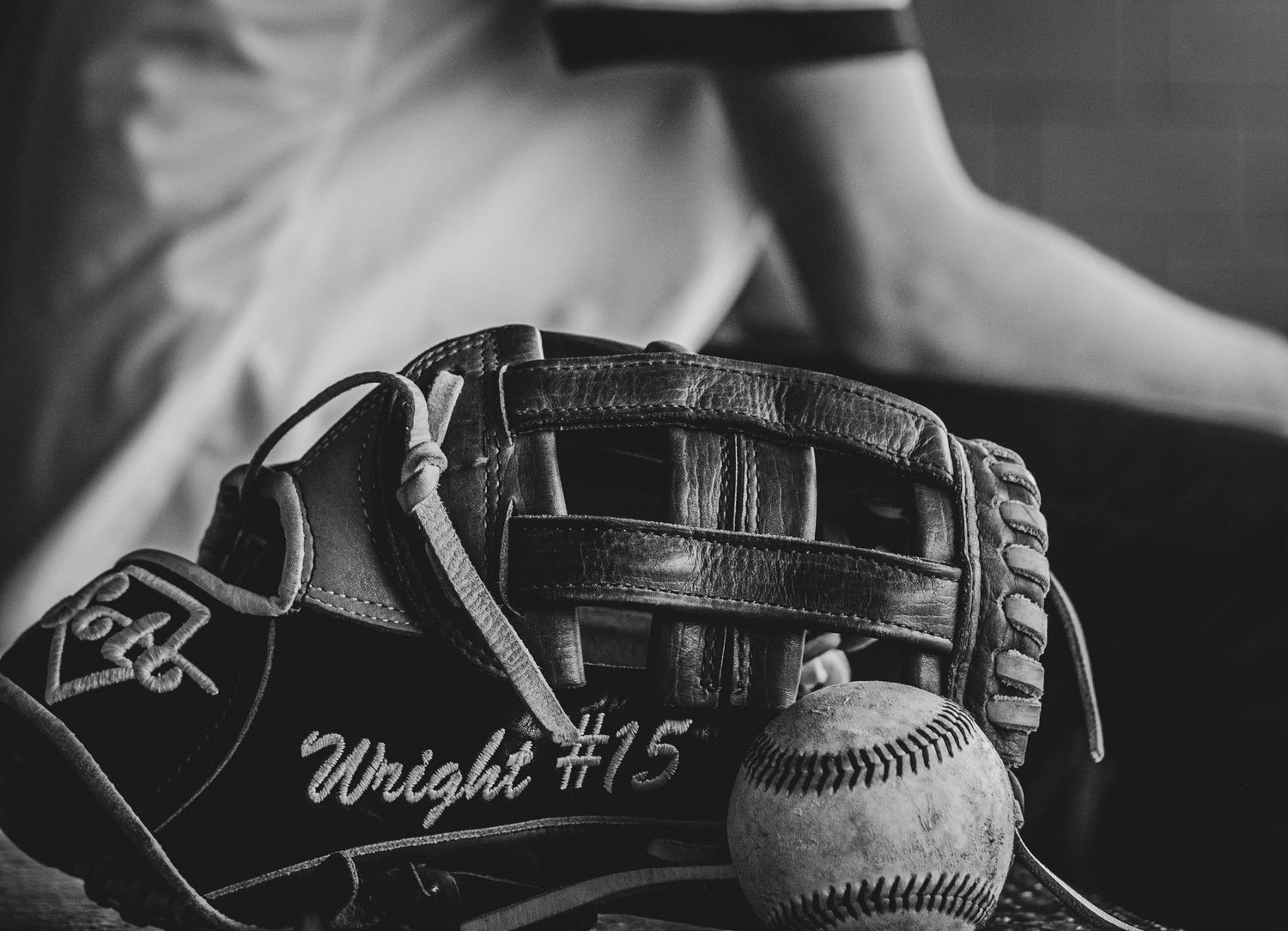 senior boy base ball players glove with last name and ball in black and white