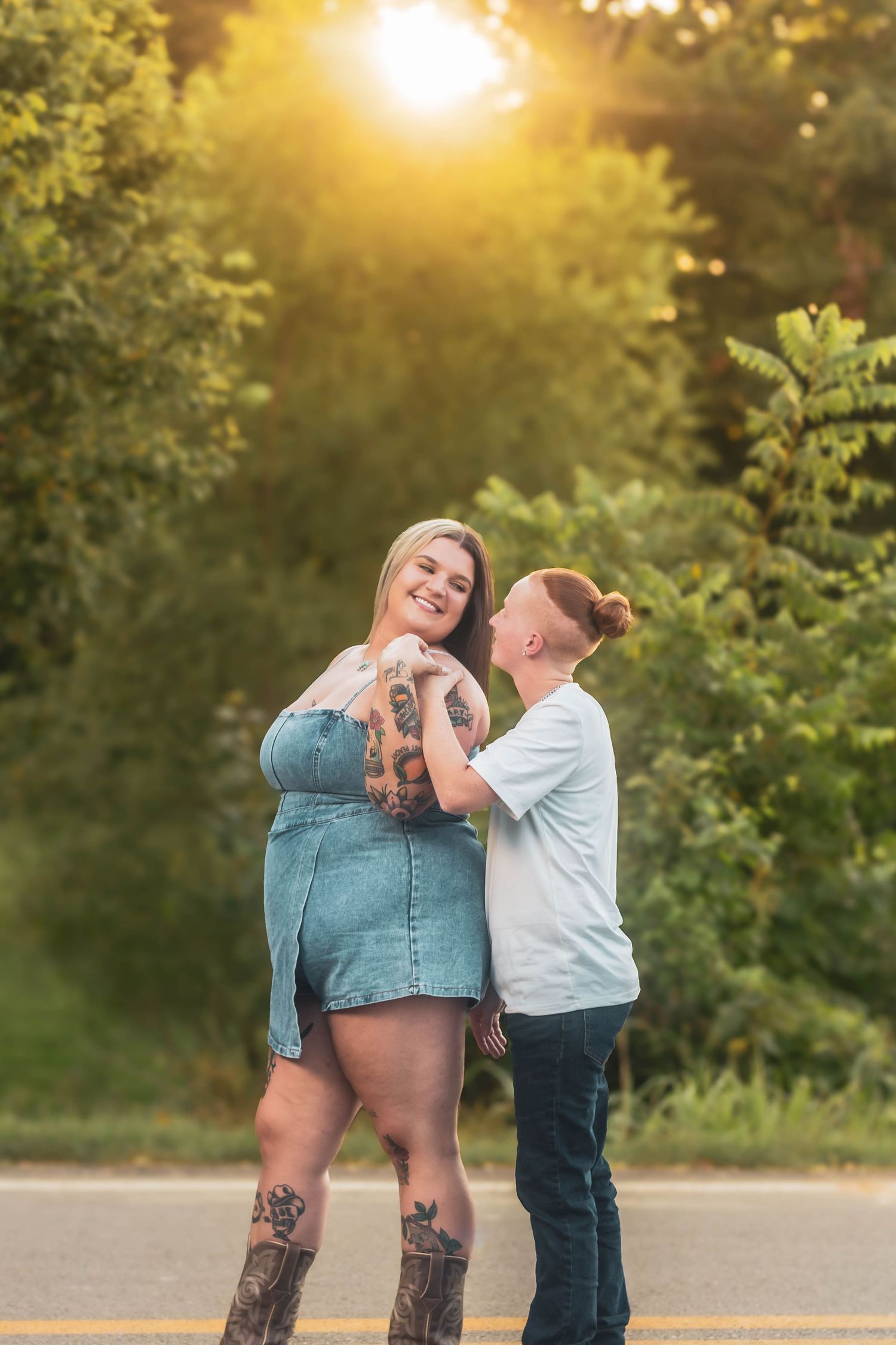Playful couple laughing together during an outdoor session.