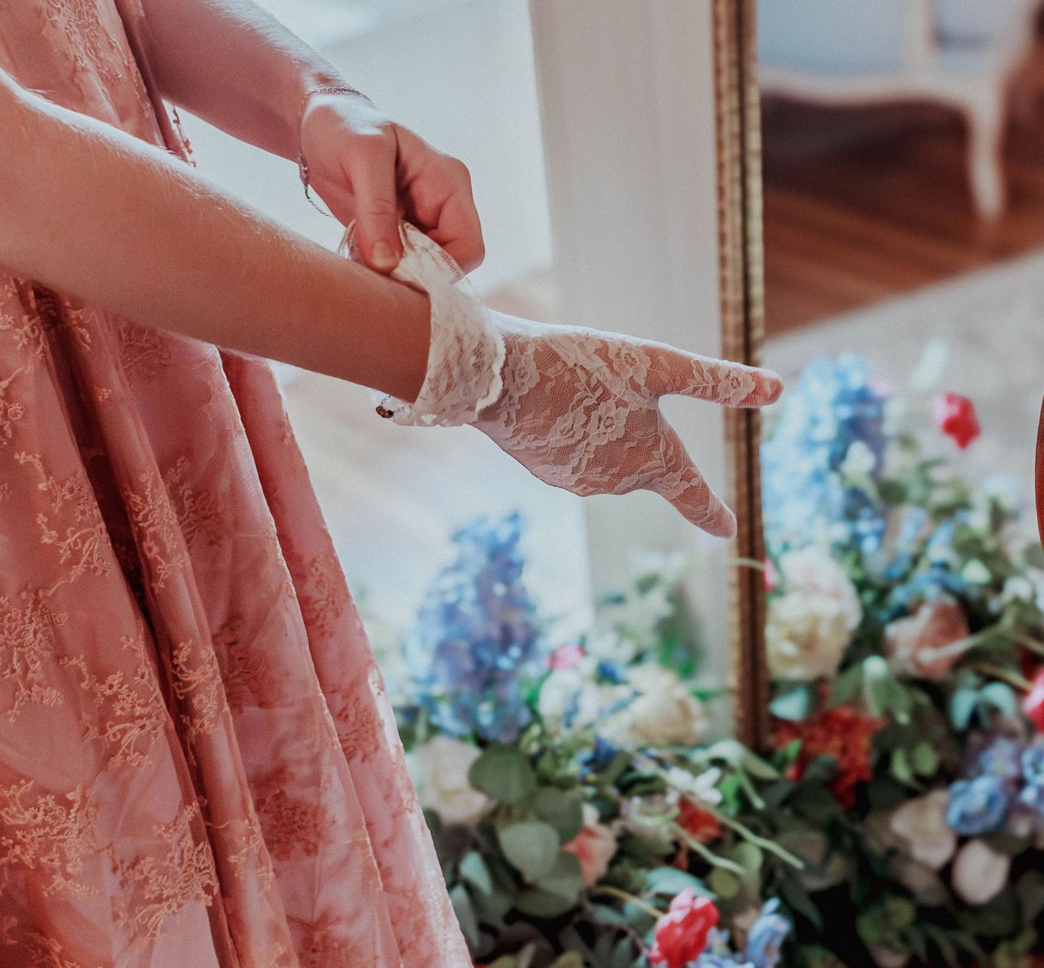 Bride fastening a bracelet while getting ready for her wedding.