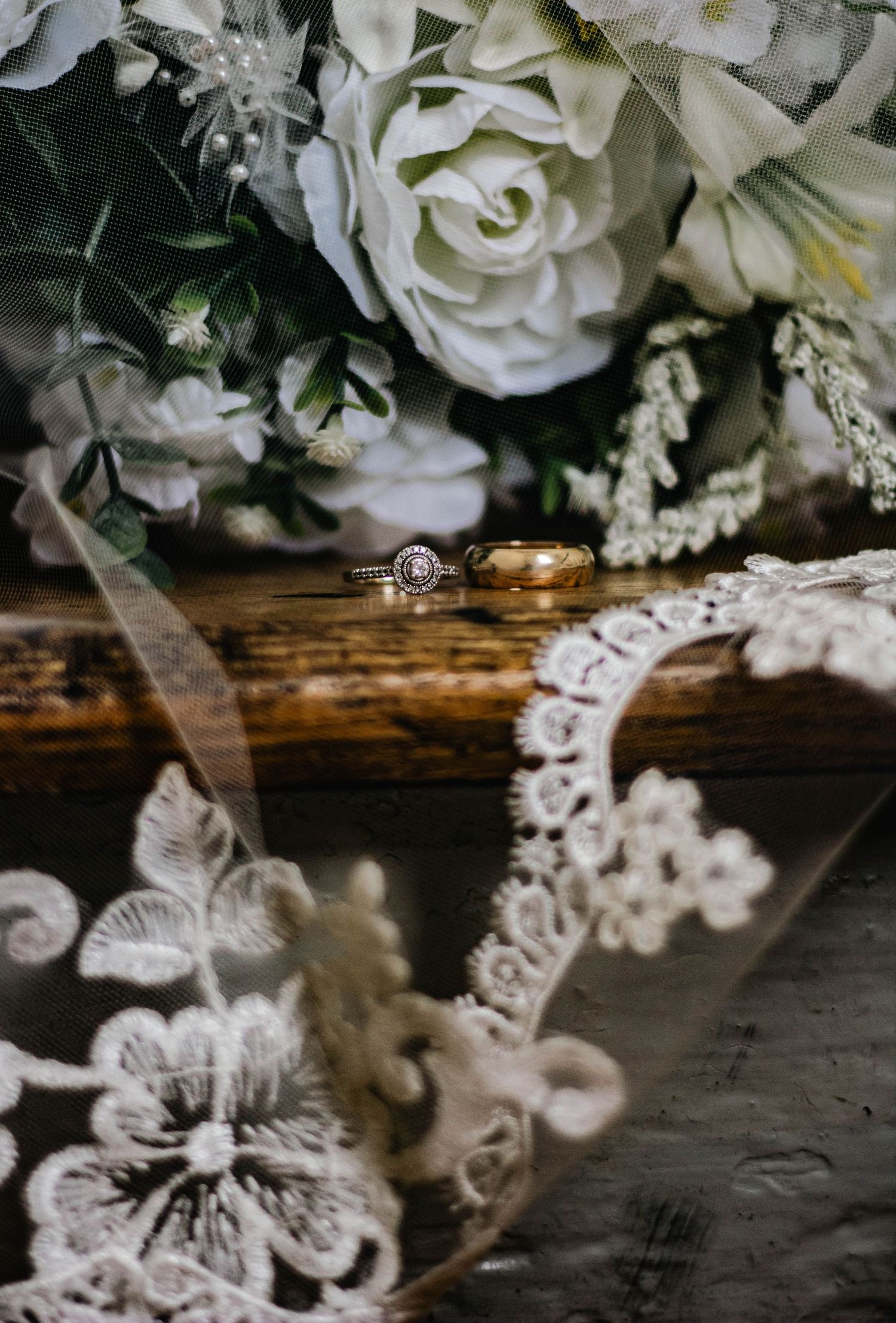 Close-up of white bridal bouquet and wedding floral details.