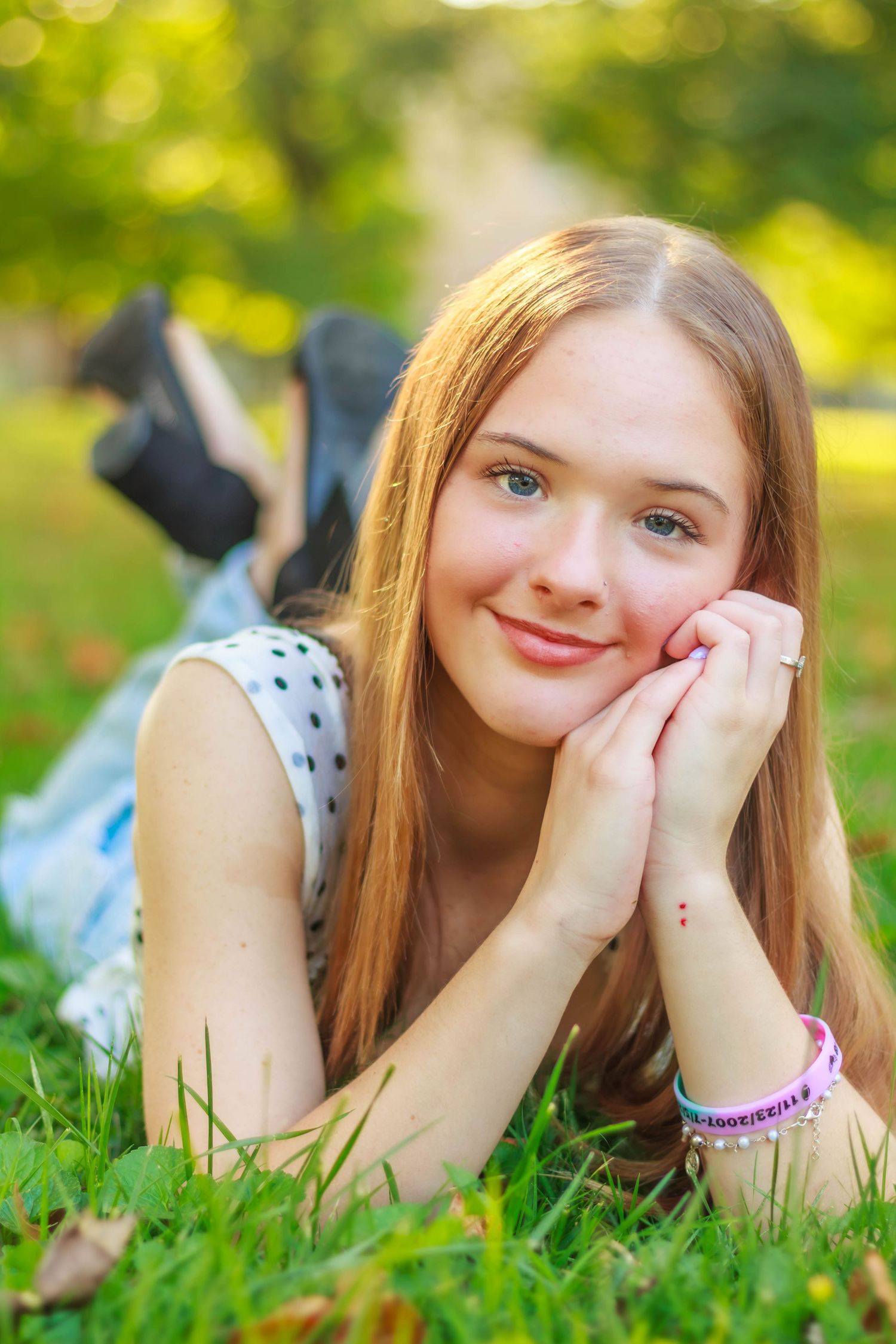 High school senior girl posing outdoors for a senior portrait session
